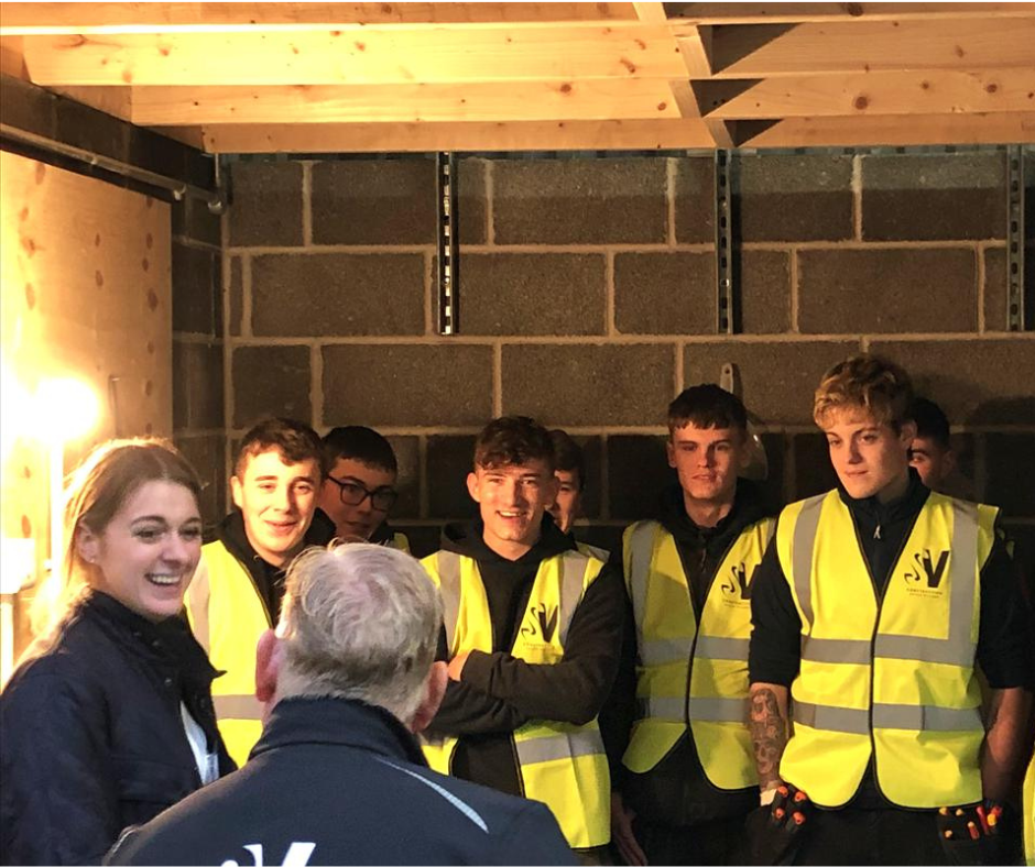A group of young people in a construction training session at Scarborough Skills Village
