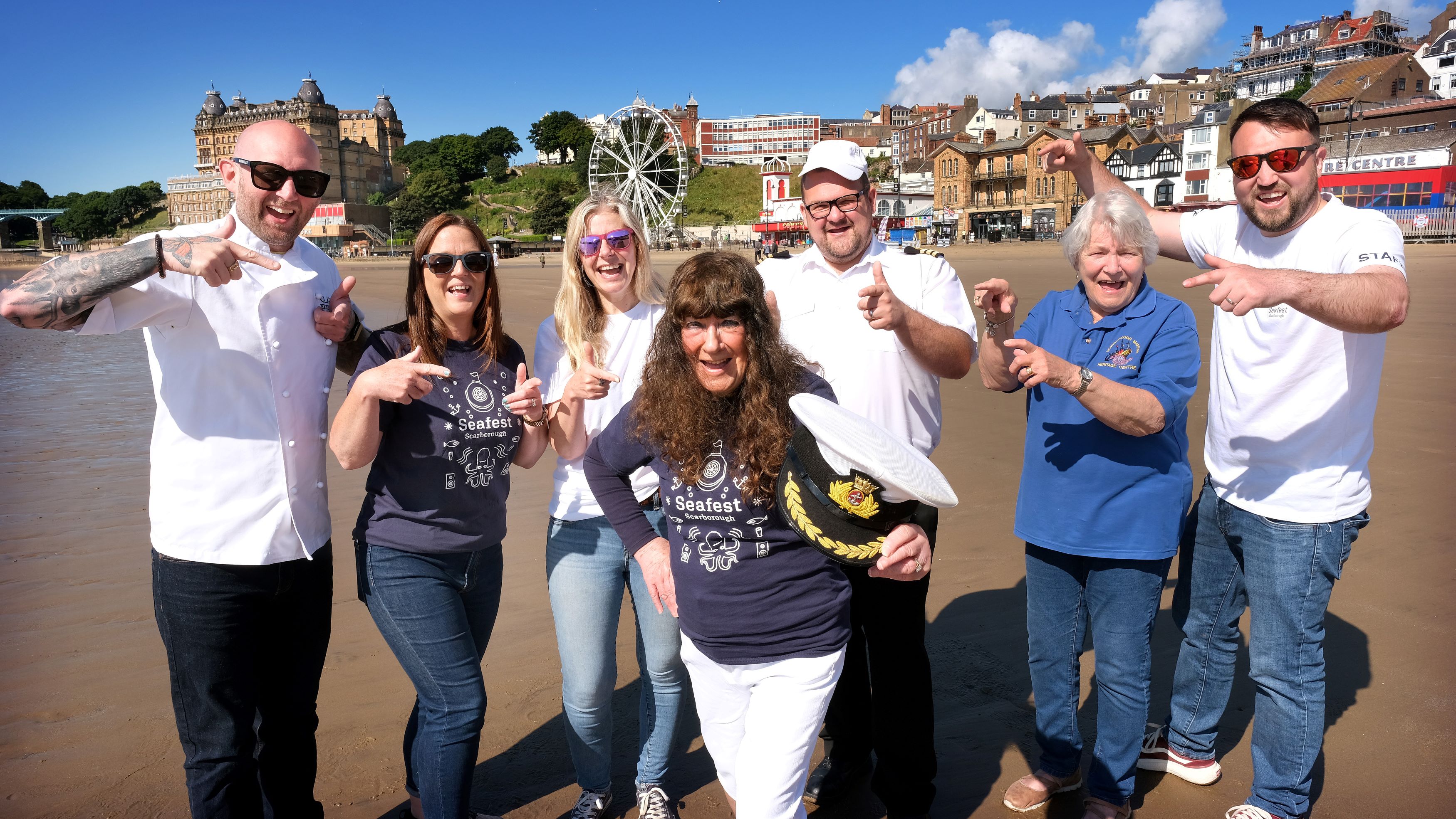 The Chef Patron at Clark’s Restaurant, Rob Clark, North Yorkshire Council’s attractions and events delivery manager, Vicki Jones, North Yorkshire Council’s events assistant, Faye Francis, North Yorkshire Council’s member for the Castle division, Cllr Janet Jefferson, North Yorkshire Council’s harbour operations manager, James Buck, Scarborough Maritime Heritage Centre vice chair, Lindy Rowley MBE and North Yorkshire Council’s events assistant, Karl Cammish on Scarborough beach to promote Seafest.