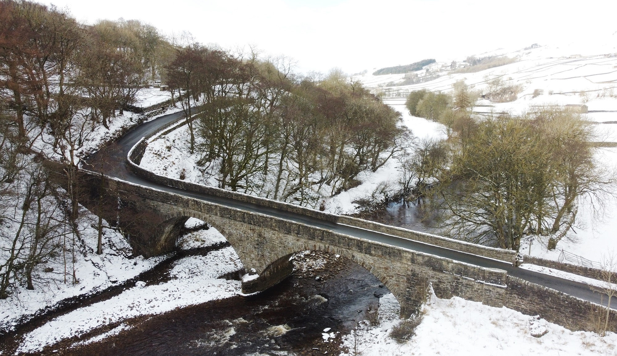 Snowy bridge in Gunnerside