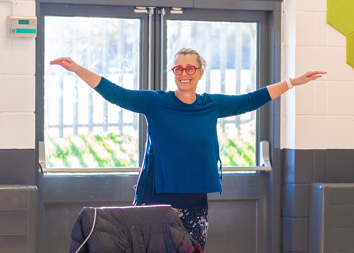 A woman taking part in a balance class at Fairfax Community Wellbeing Hub