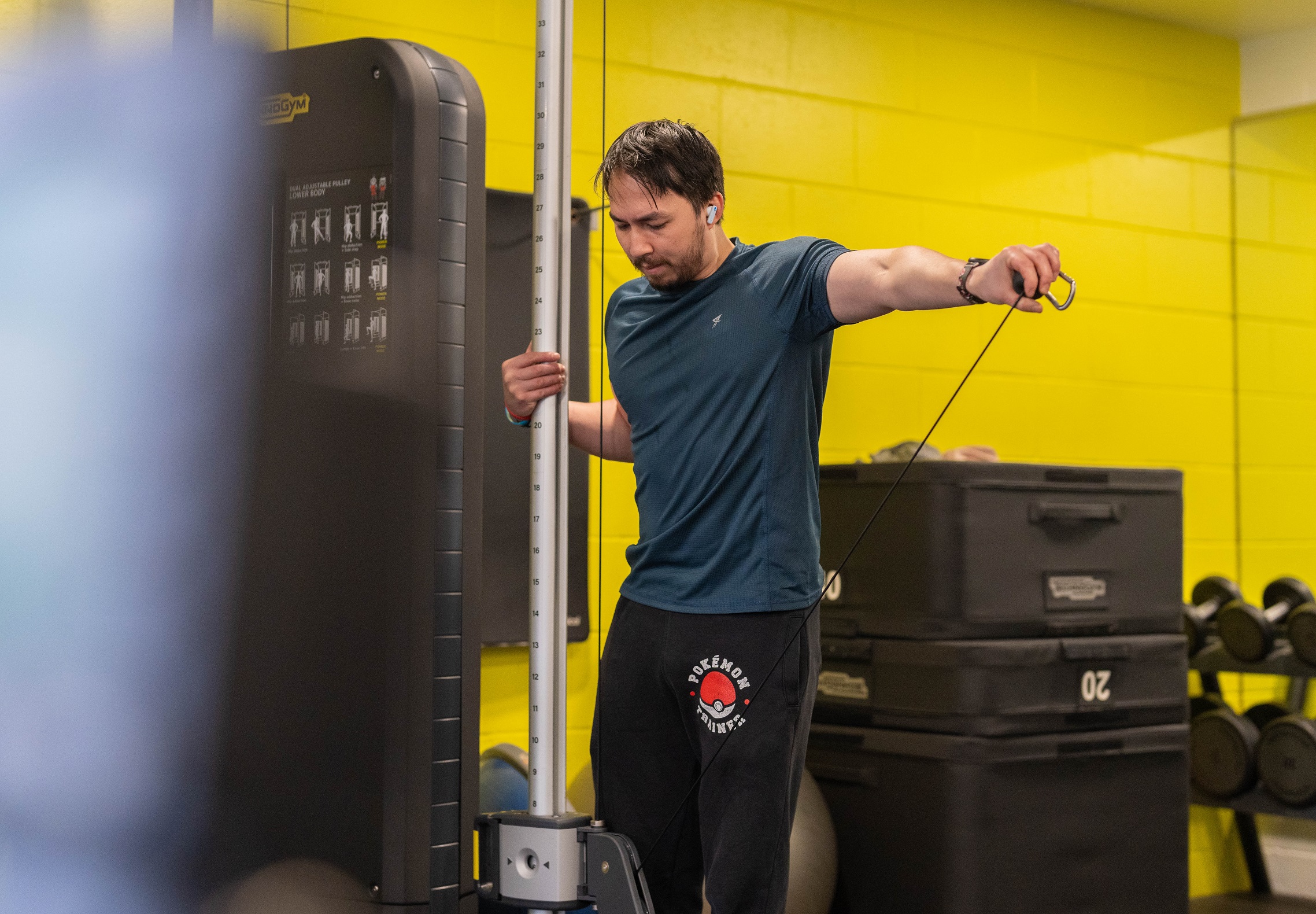 A man using exercise equipment in the gym at Pateley Bridge Leisure and Wellbeing Hub