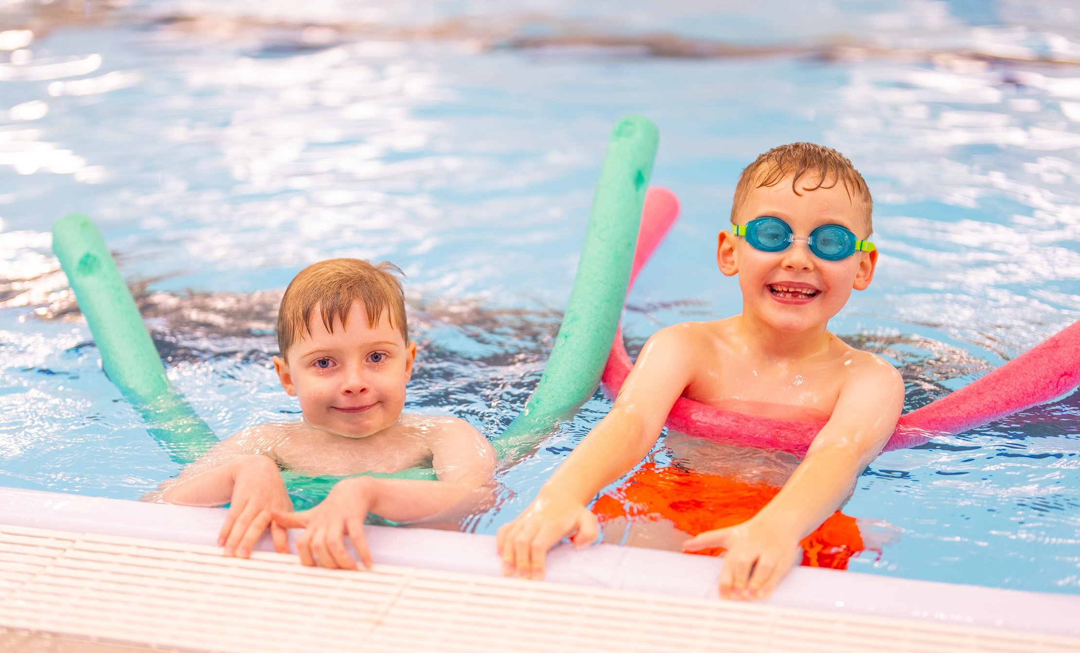 Two young boys using floats in the swimming pool at the Ripon Leisure and Wellbeing Hub - The Jack Laugher Centre