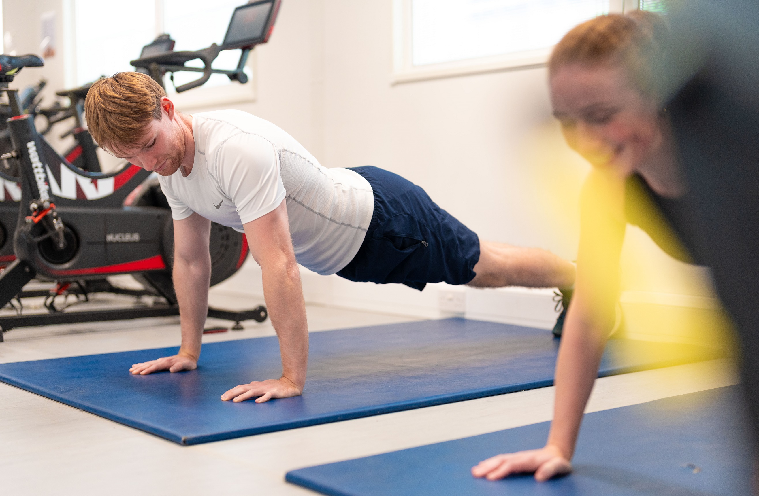 Two people doing press-ups among the gym equipment at Ripon Leisure and Wellbeing Hub - The Jack Laugher Centre
