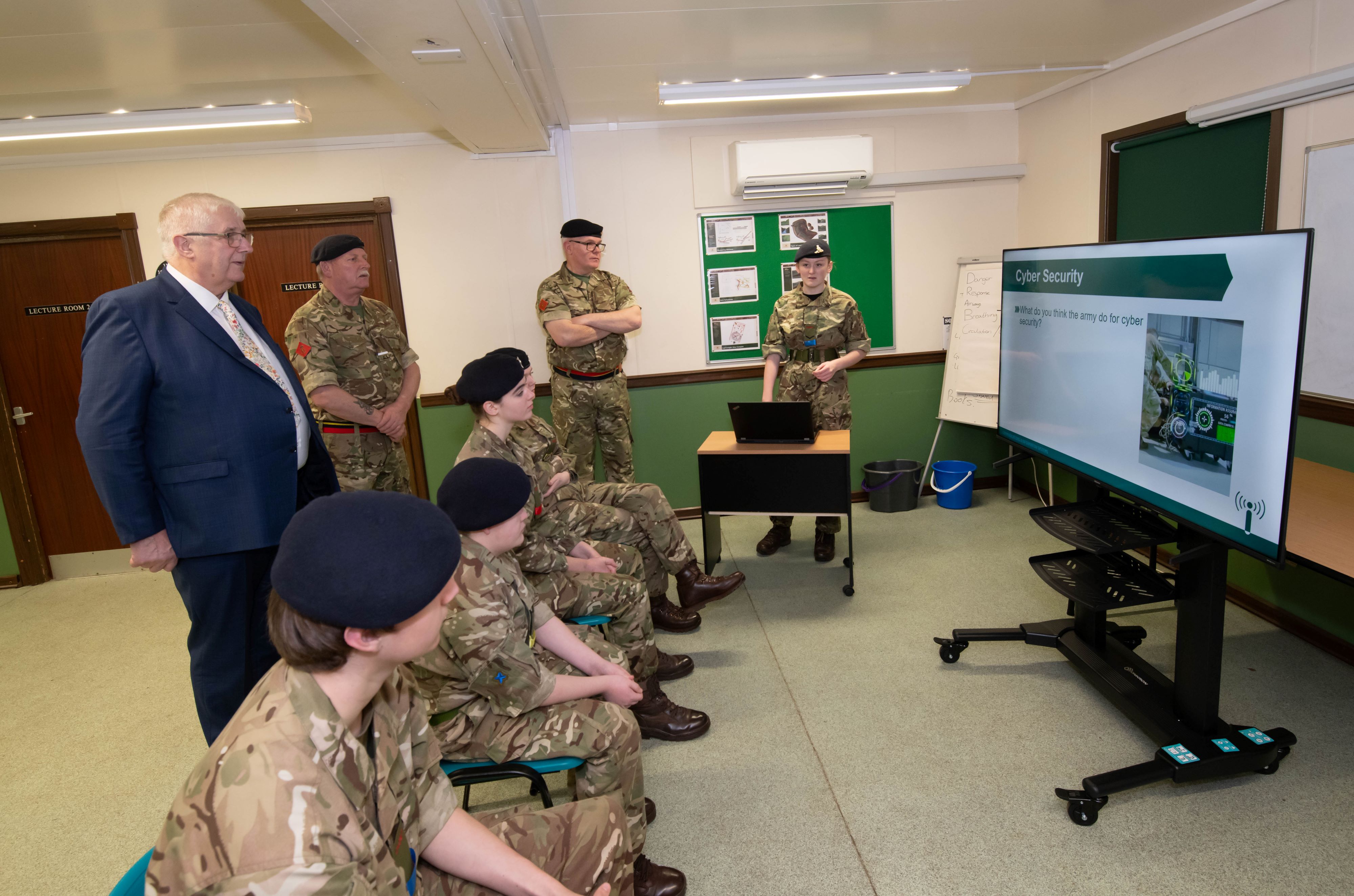Cllr Ireton watches training presentation with cadets
