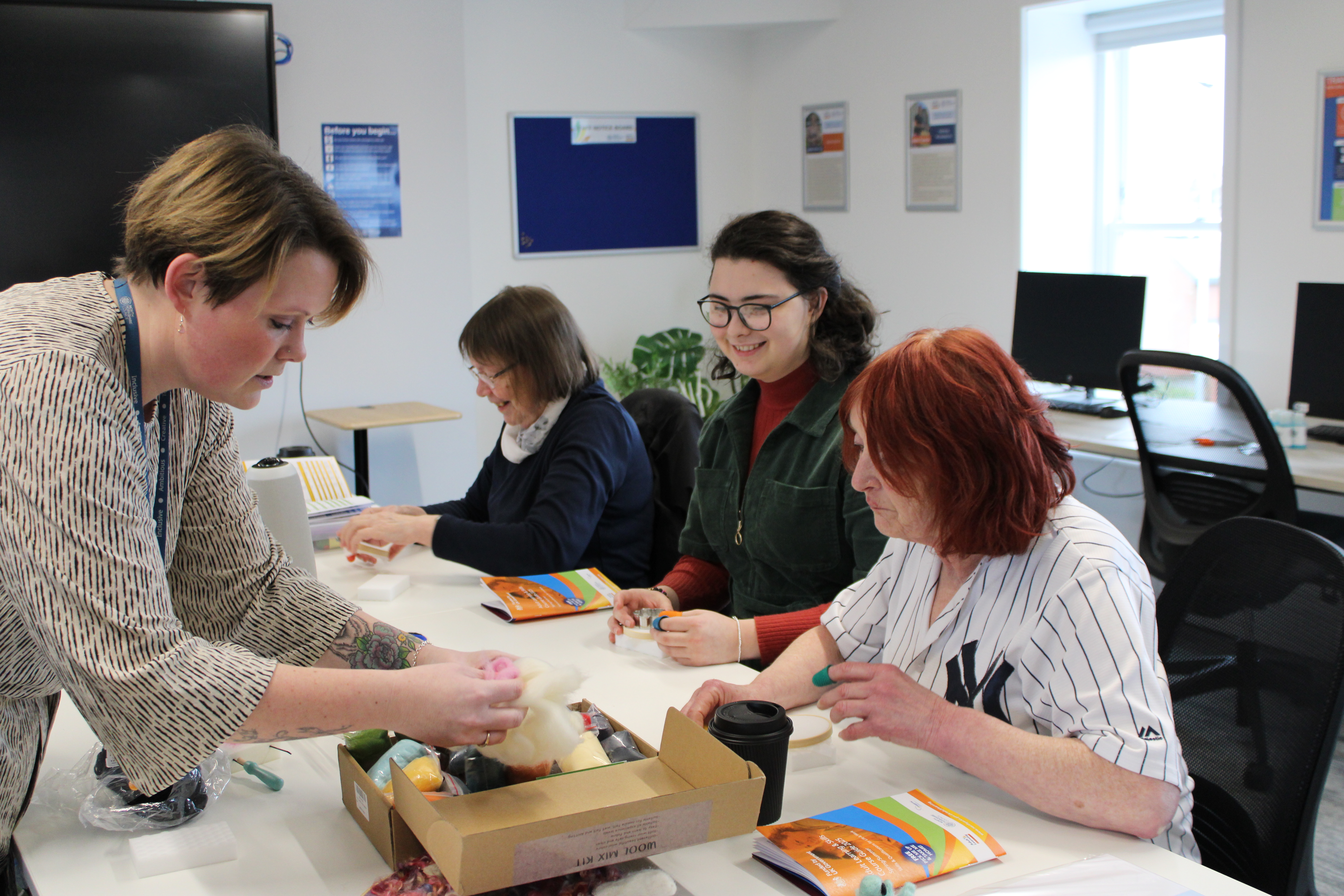A teacher in a classroom with adults