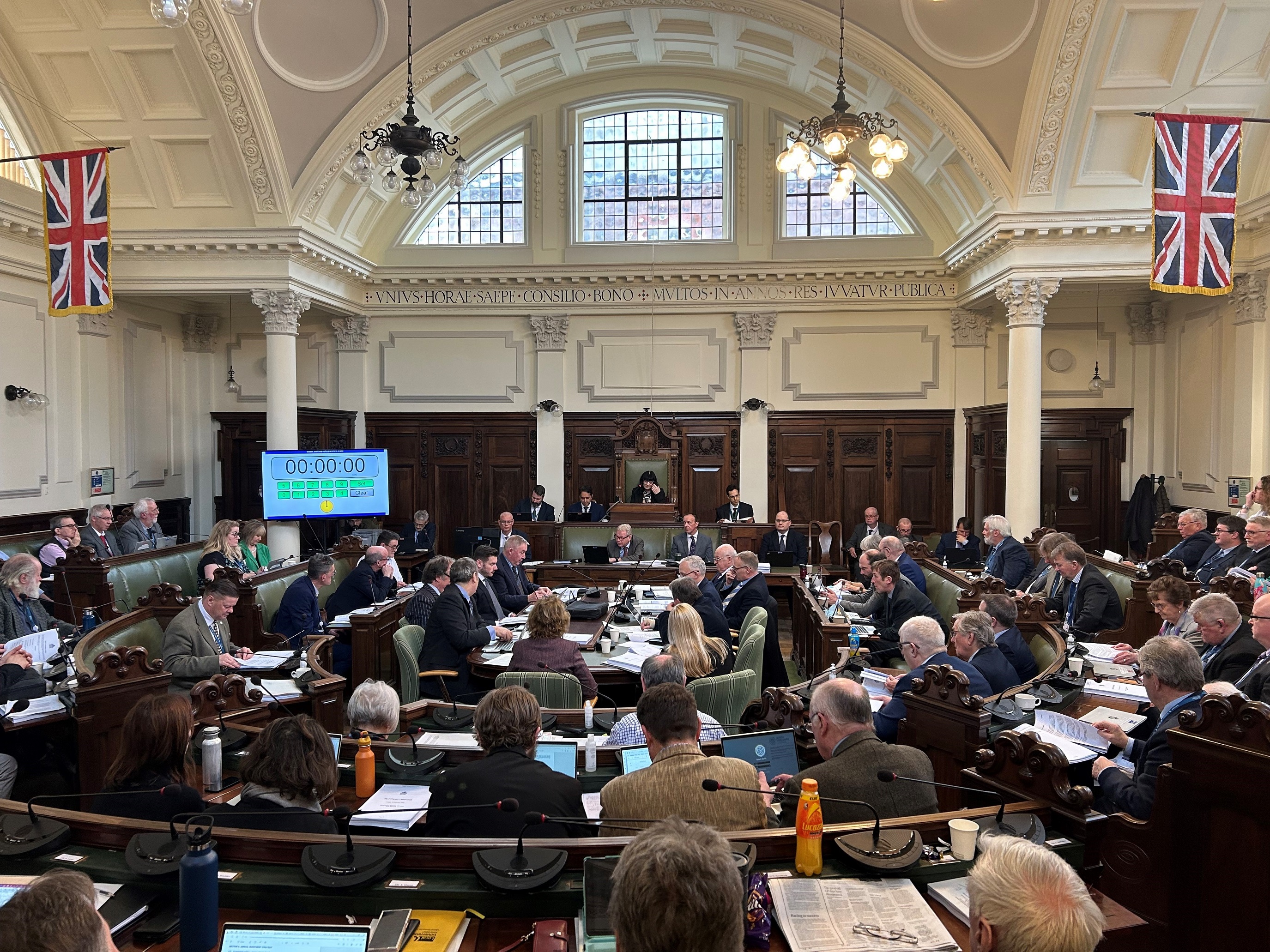 Councillors inside the council chamber at a full council meeting