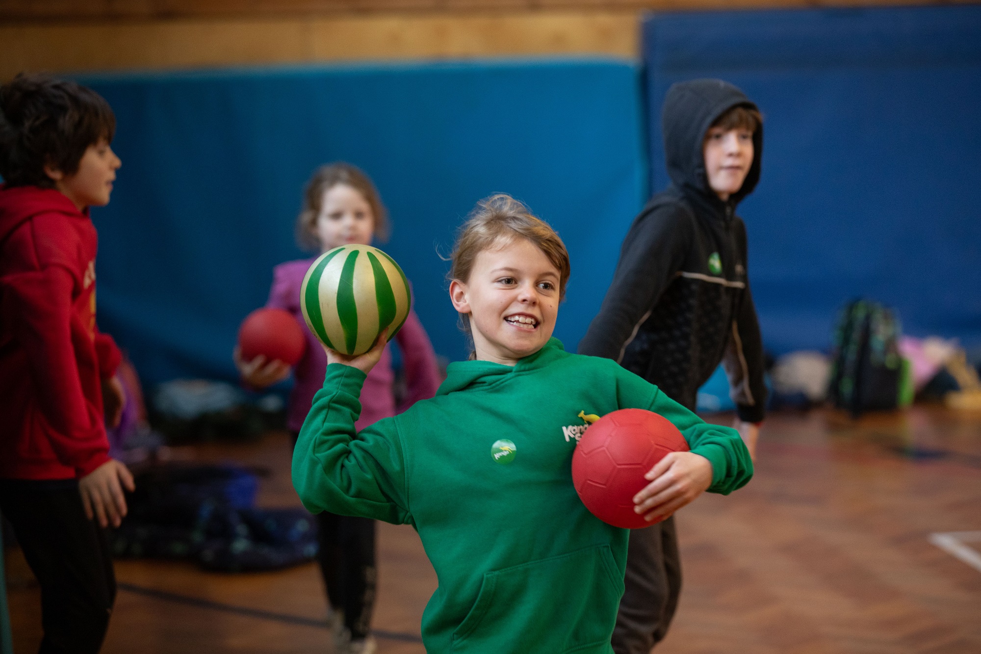 A young boy throwing a ball