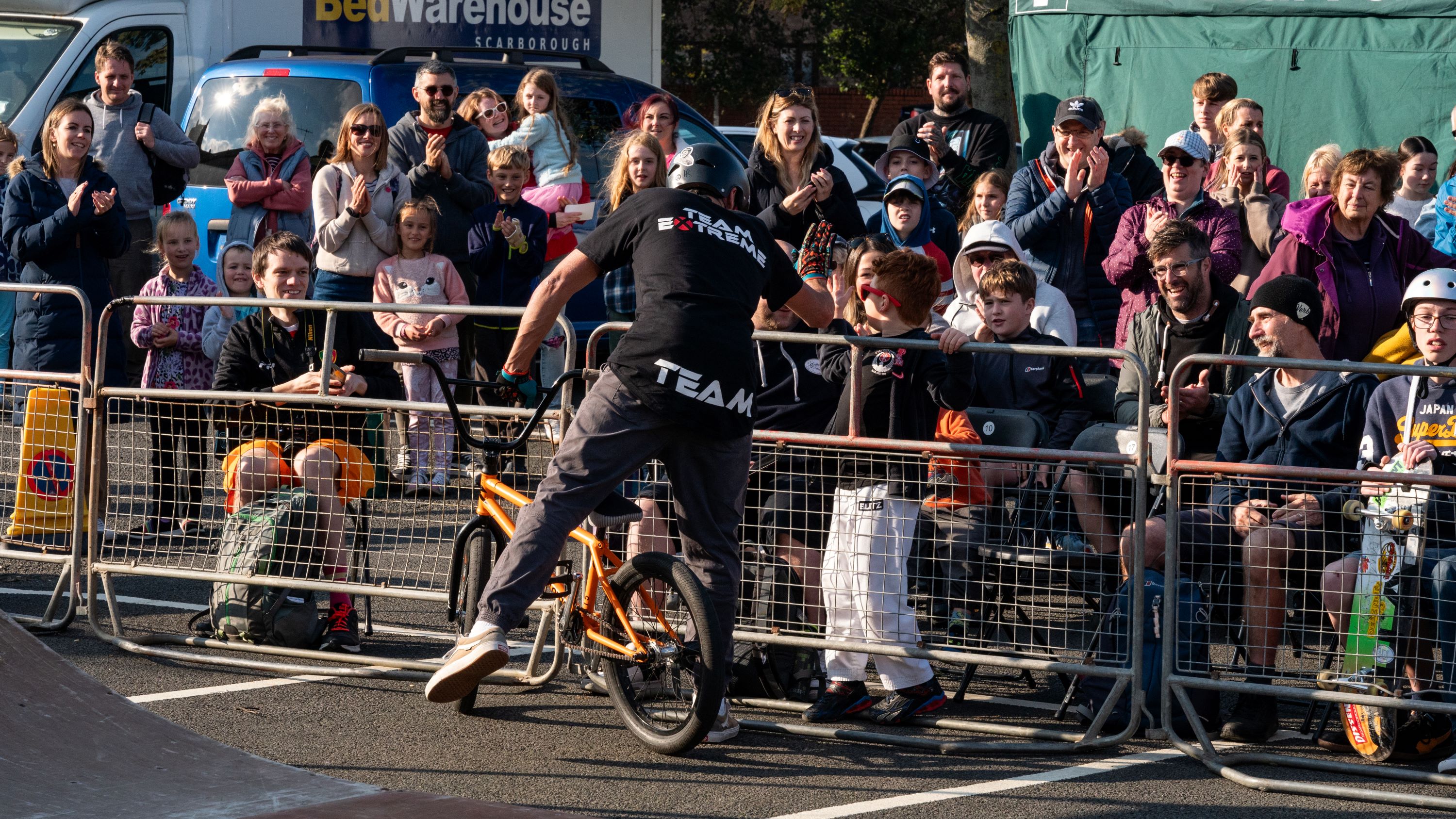 A BMX rider with crowds at Scarborough Fair