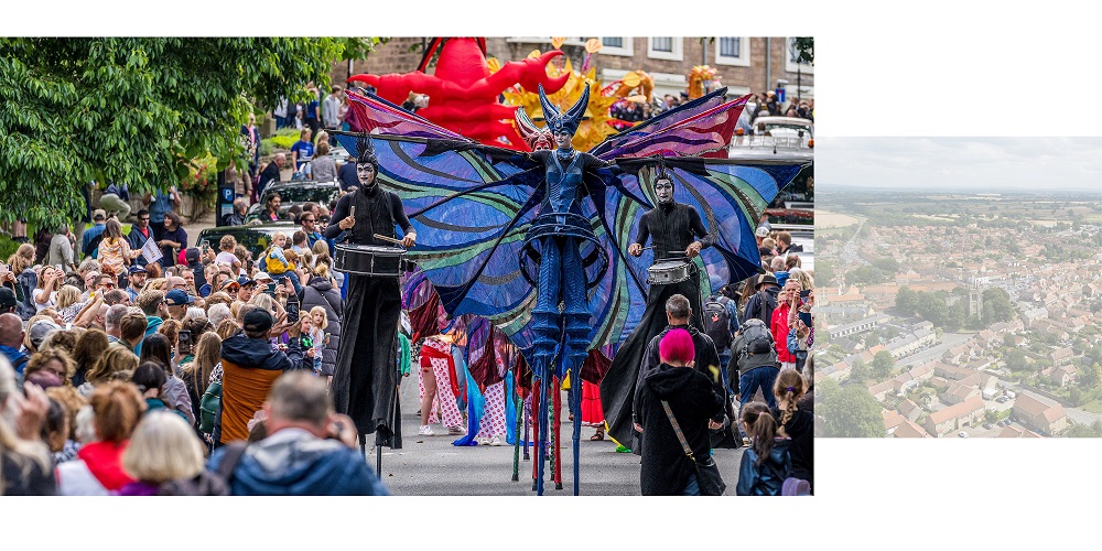 Festival parade down a street
