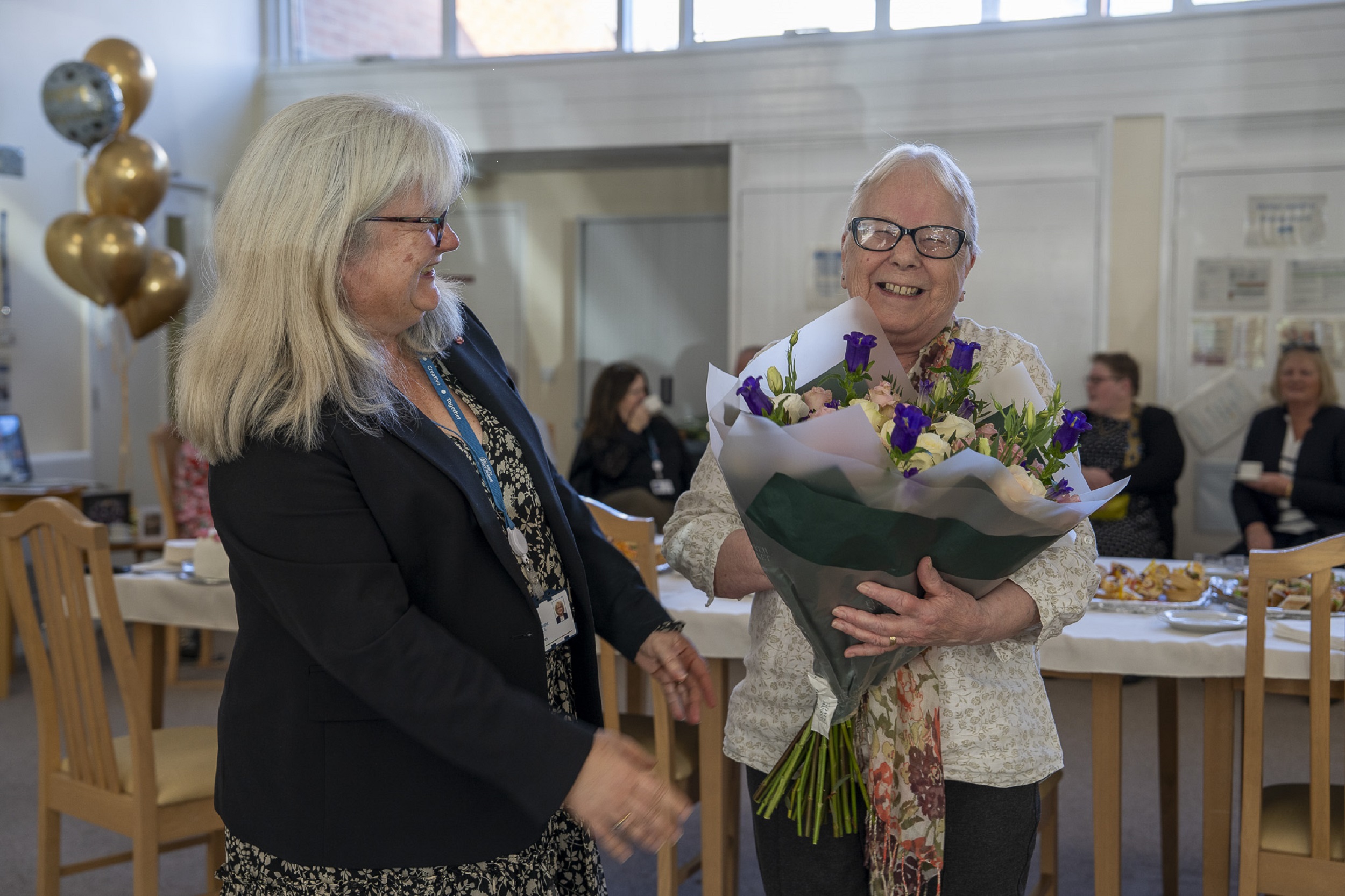 Dot holding flowers with Rachel Bowes