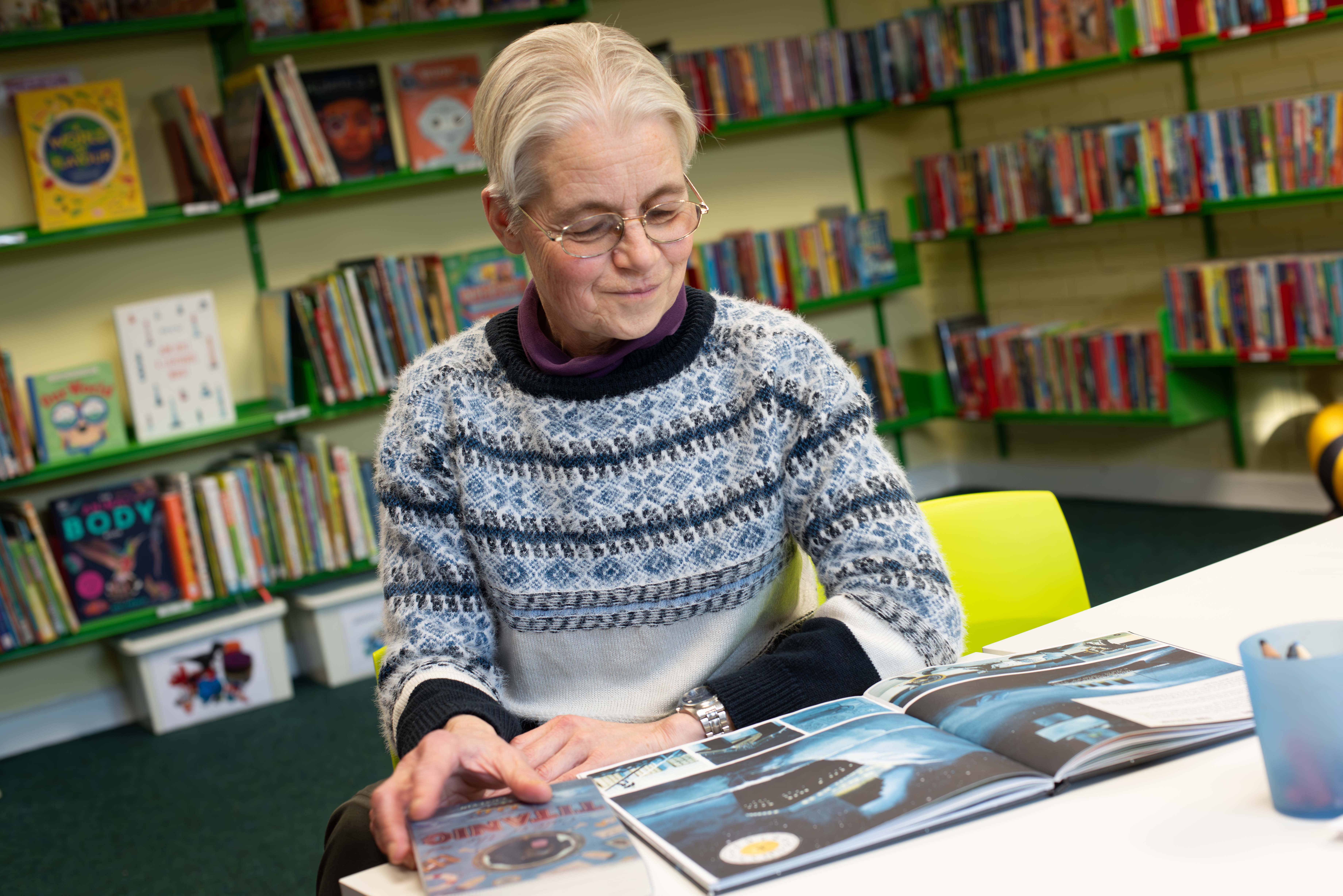 Photo of Heather Woolley reading a book