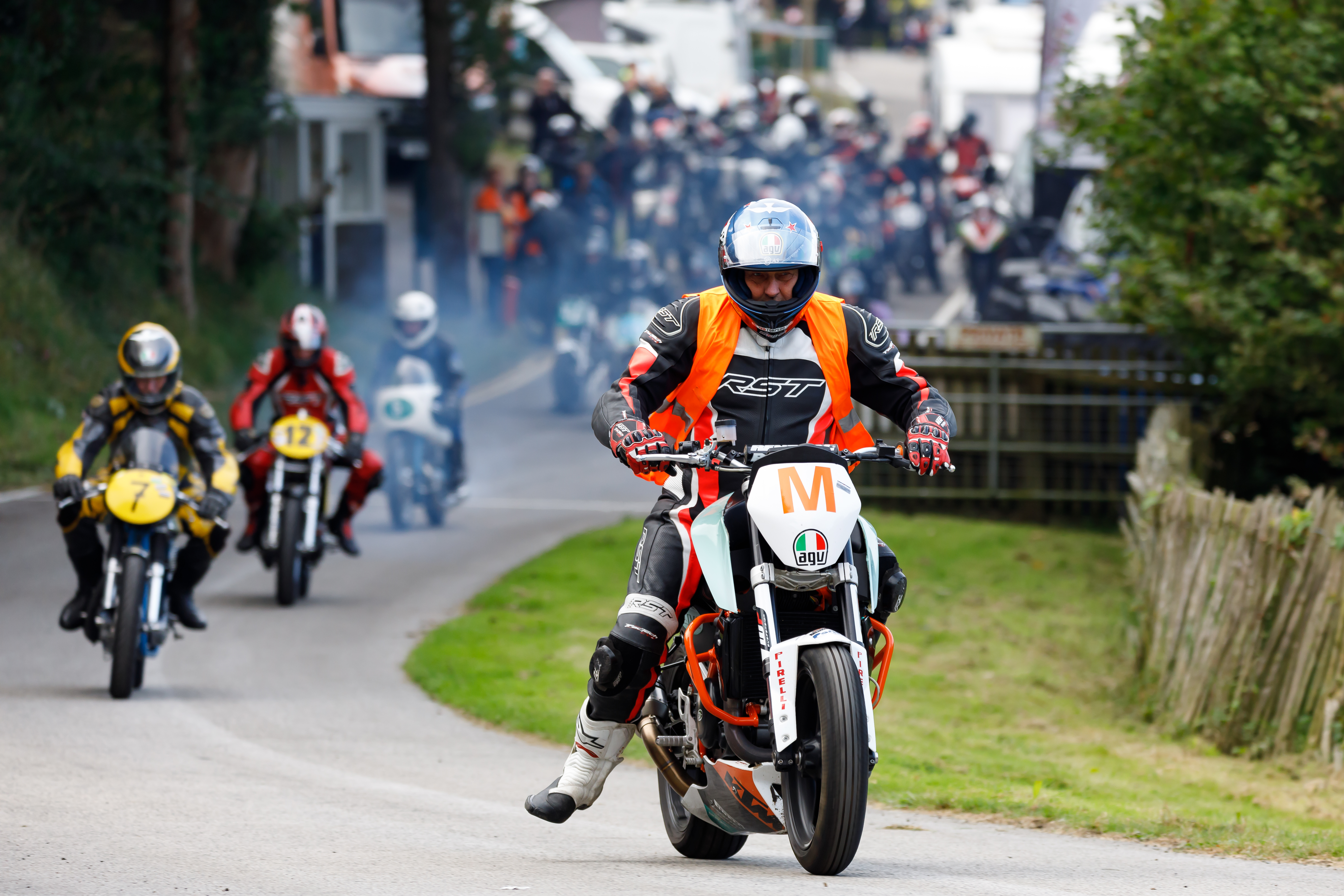 Several motorbikes riding down a road. Image credit Ben Broadley