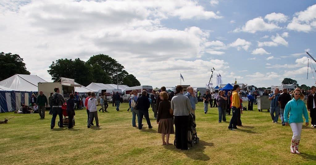 Photo of people walking around the North Yorkshire Agricultural Show on a cloudy day