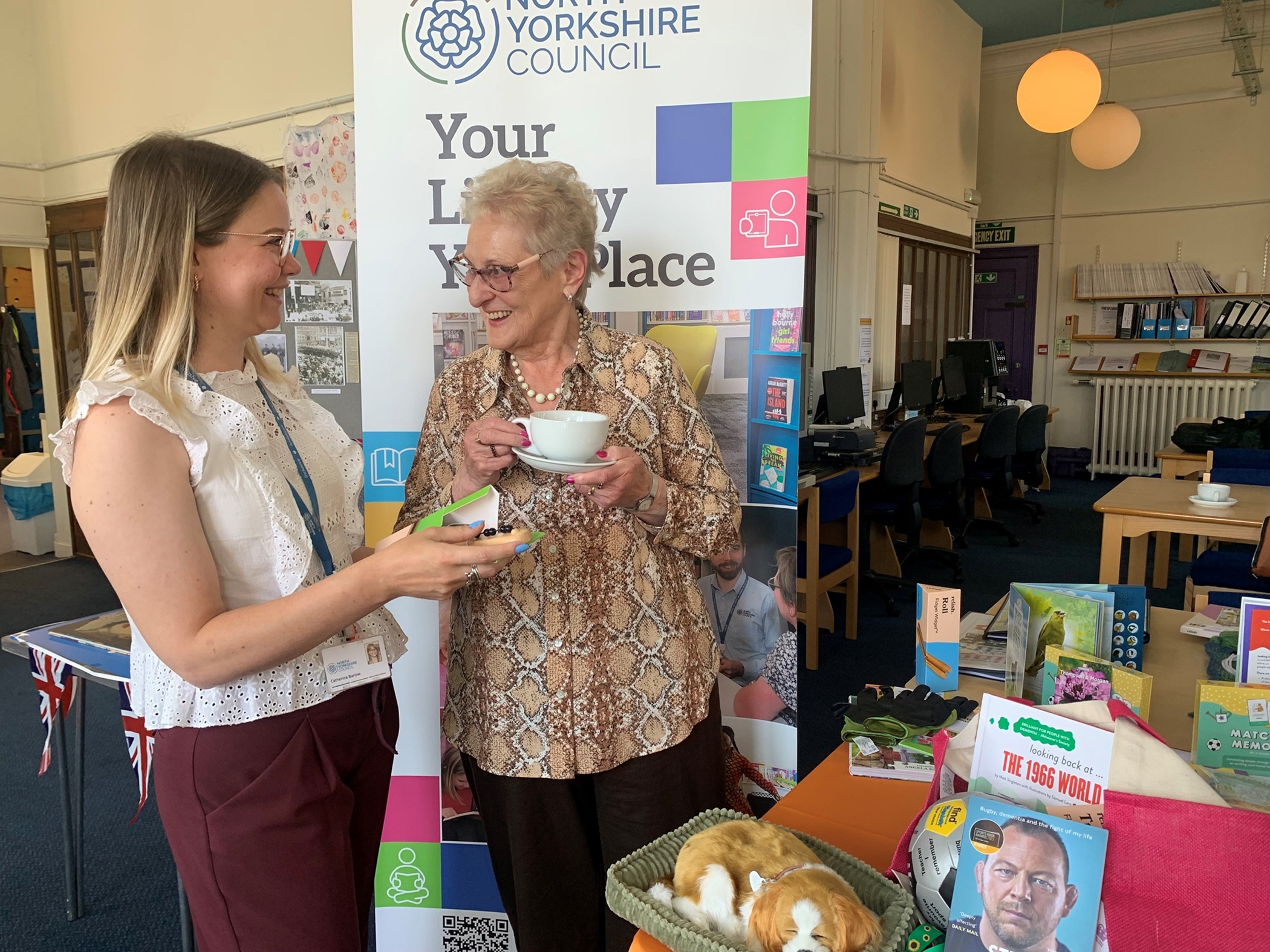 Area librarian Catherine Barlow (left), and library visitor Enid Cheetham.