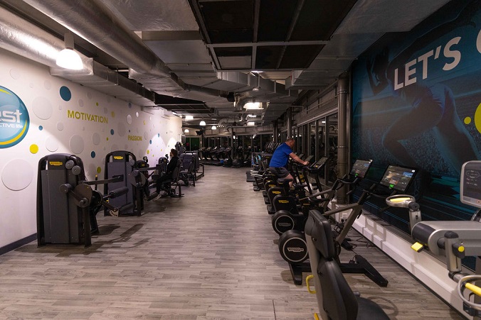 A view of the gym equipment at Northallerton Leisure and Wellbeing Hub, a man is using a treadmill and another man is working out