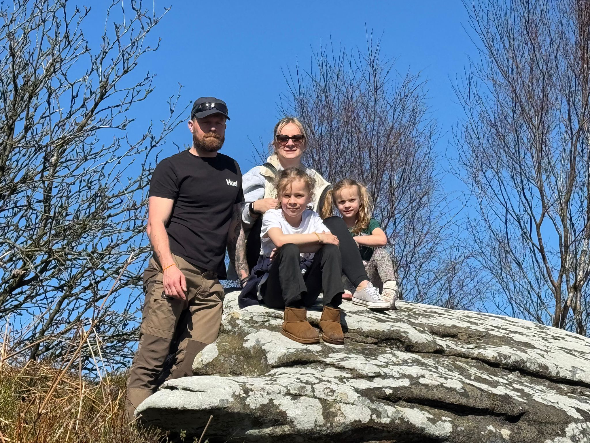 Allan and Leeanne Stewart became foster carers four years ago this month. They are pictured with their daughters Lillian and Daisy.