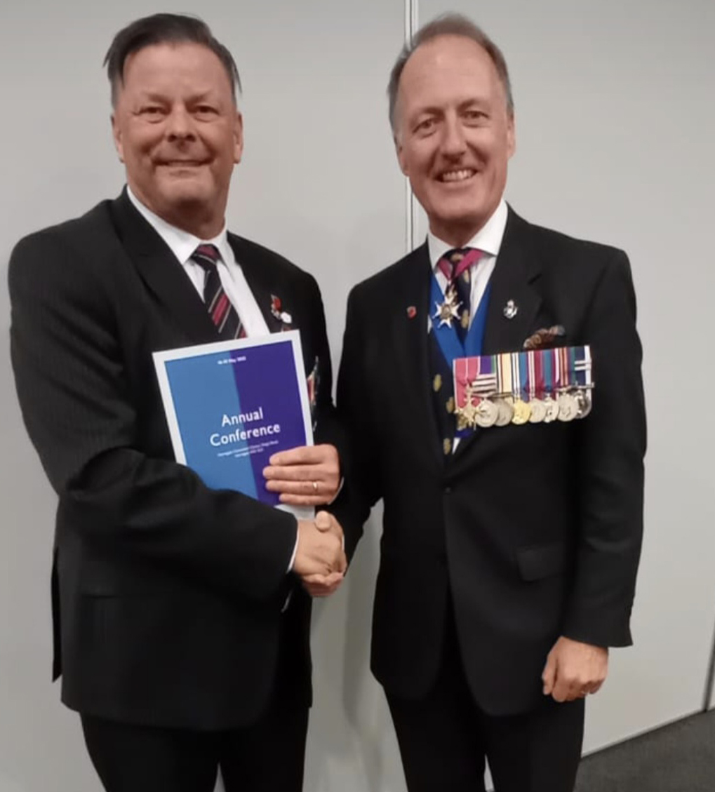 Photo of Cllr Kevin Foster shaking hands with Vice Admiral Paul Martin Bennett