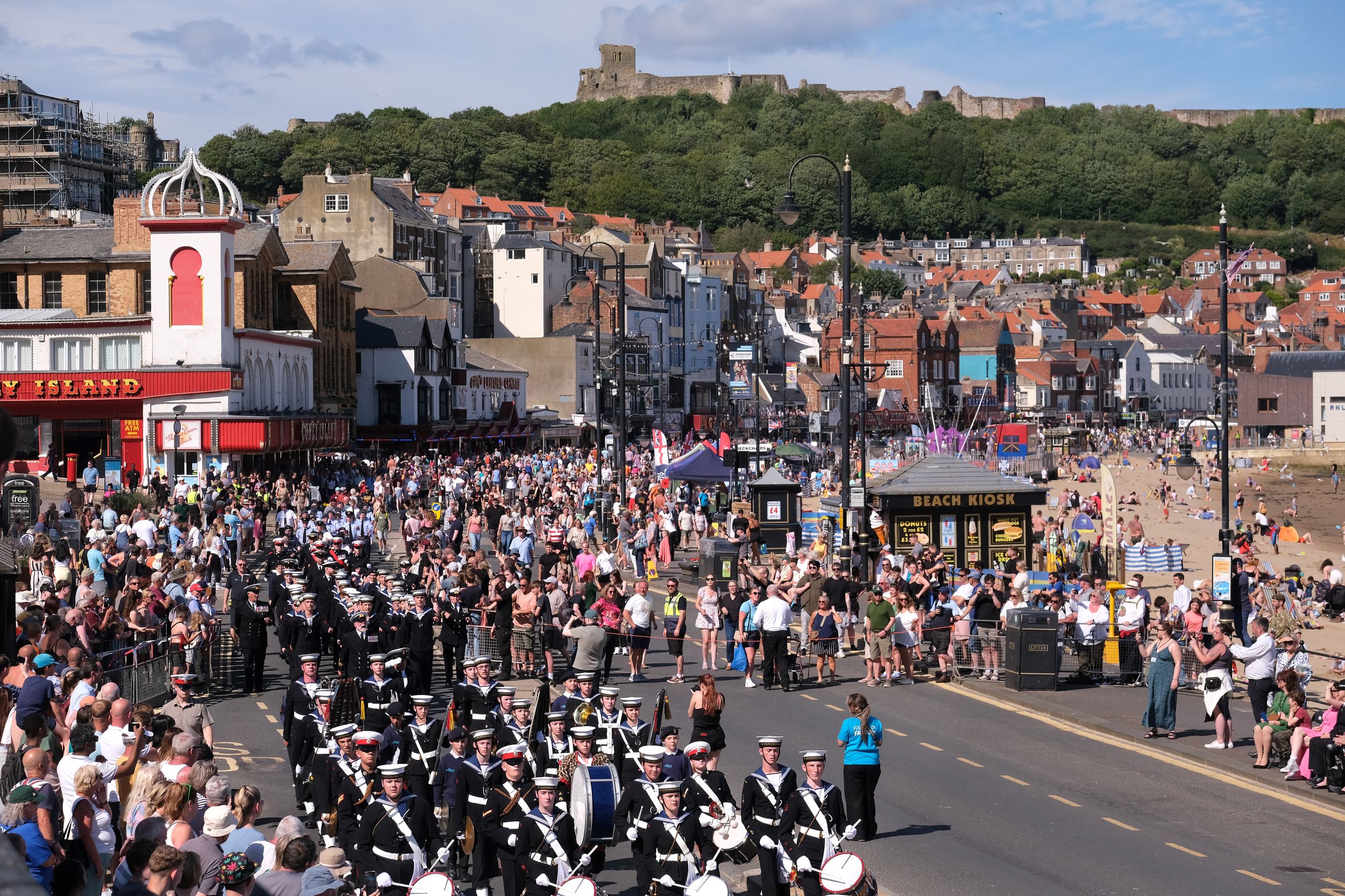 Crowds of people watching parades at Armed Forces Day
