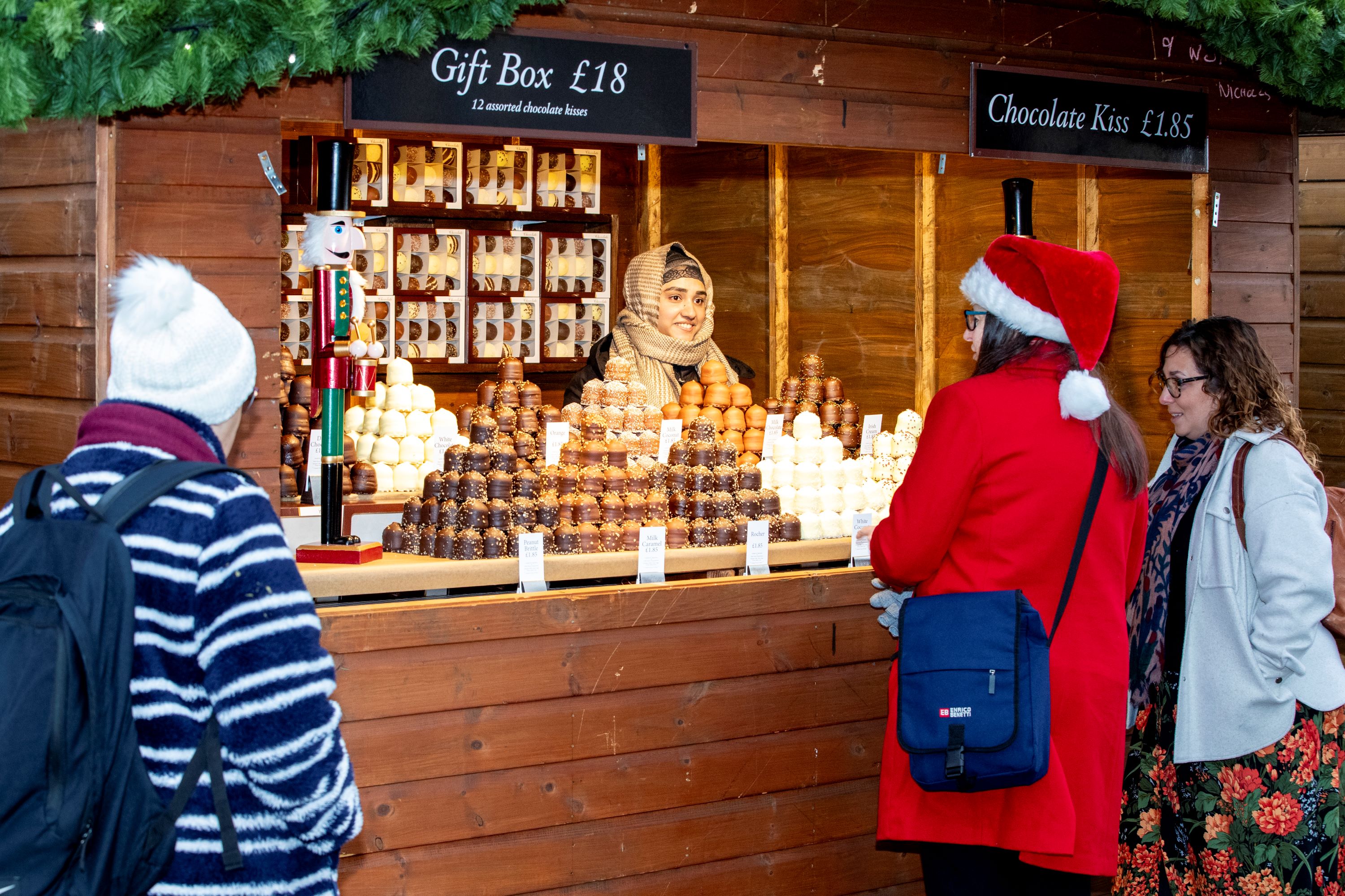 Three people at a stall at Harrogate Christmas Fayre