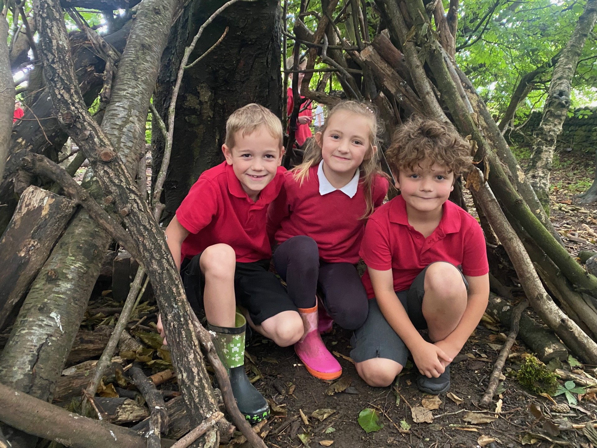 Three children in a den