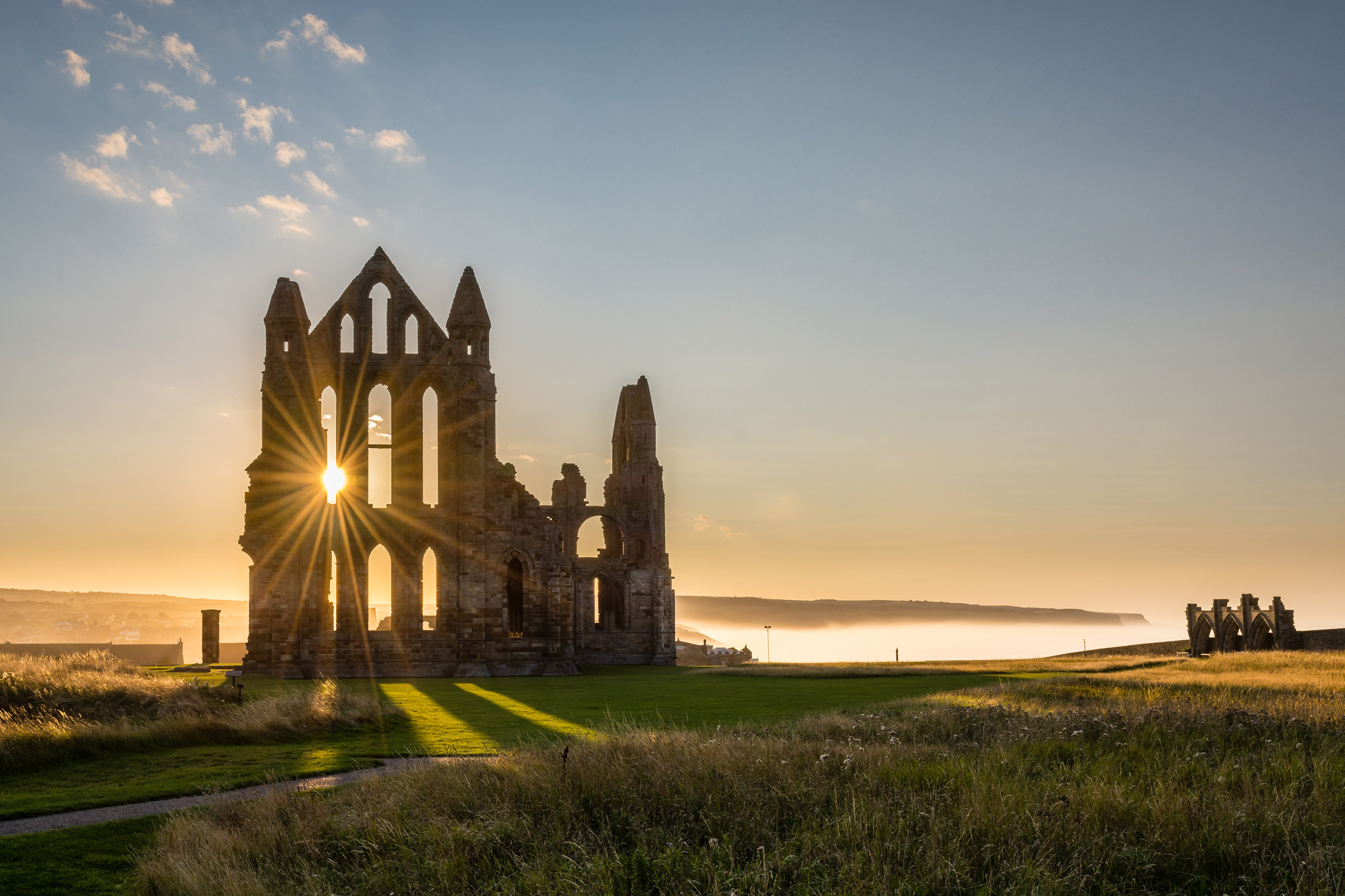 Sun shining through Whitby Abbey