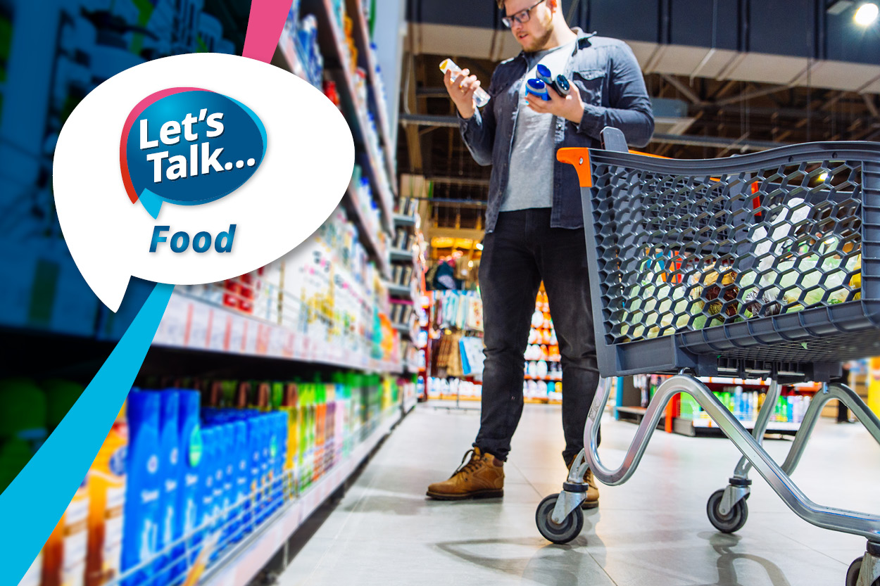 The Let's Talk food logo over a picture of a man next to a shopping trolley, choosing items in the supermarket.