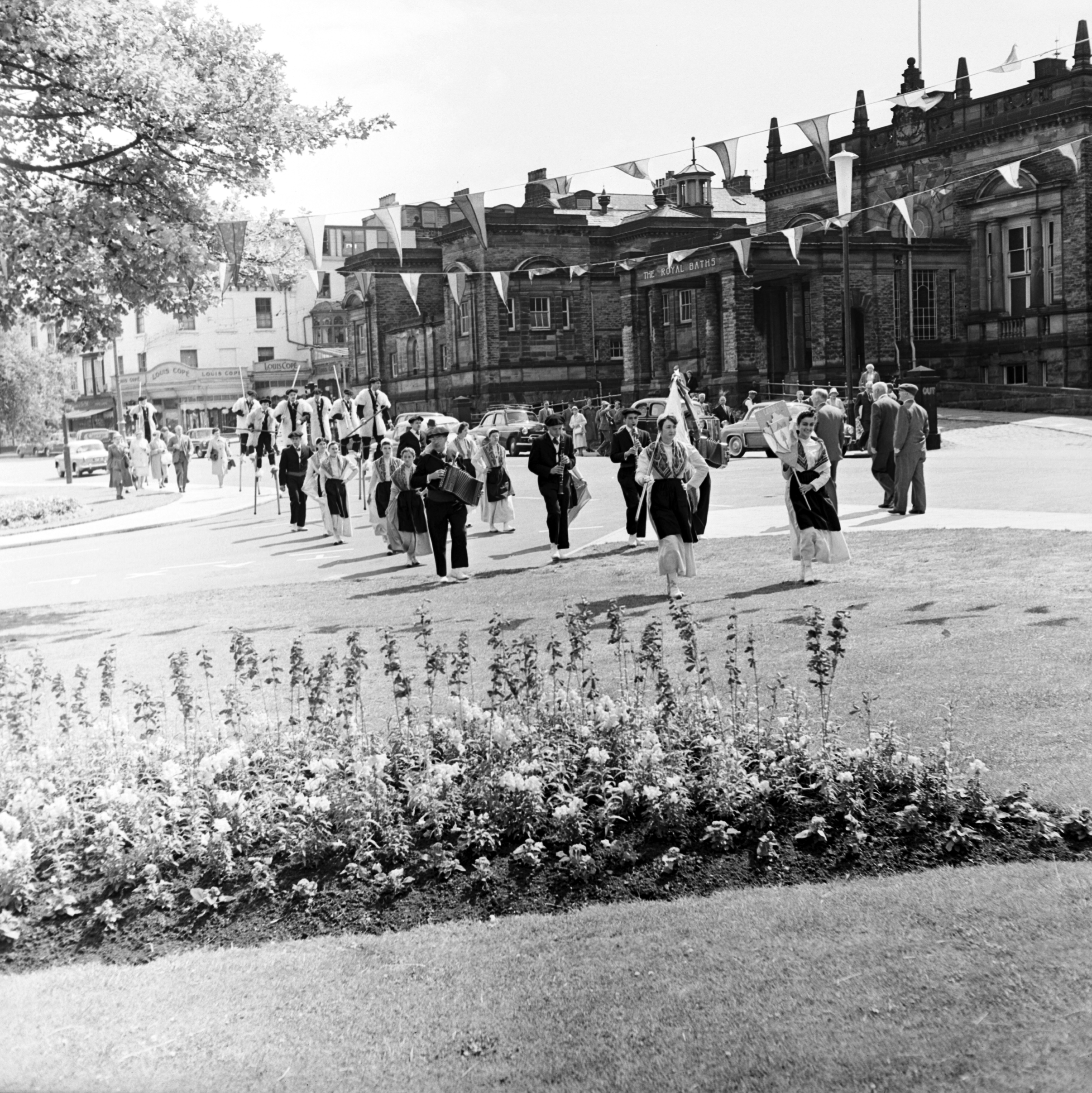 Harrogate’s French Week parade, passing in front of the Royal Baths during the 1950s. From the Bertram Unné photographic collection