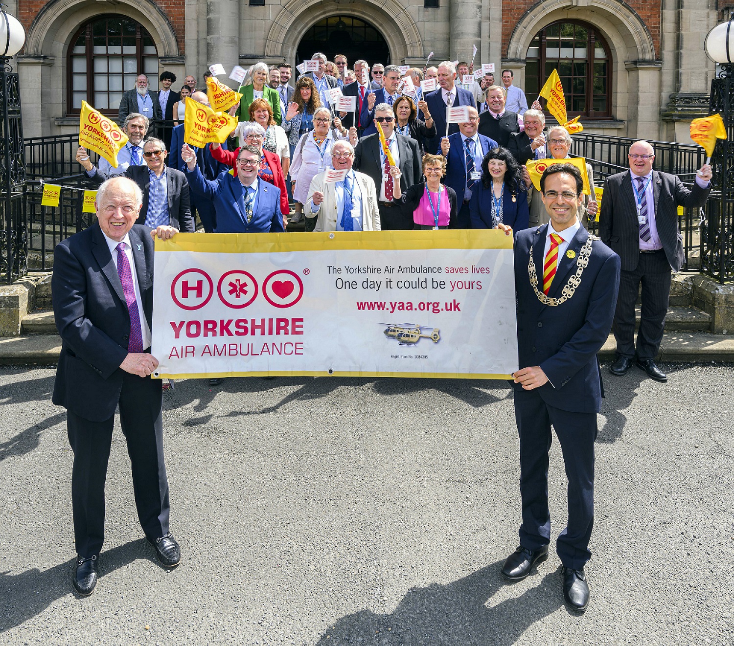 Elected members with a Great North Air Ambulance banner