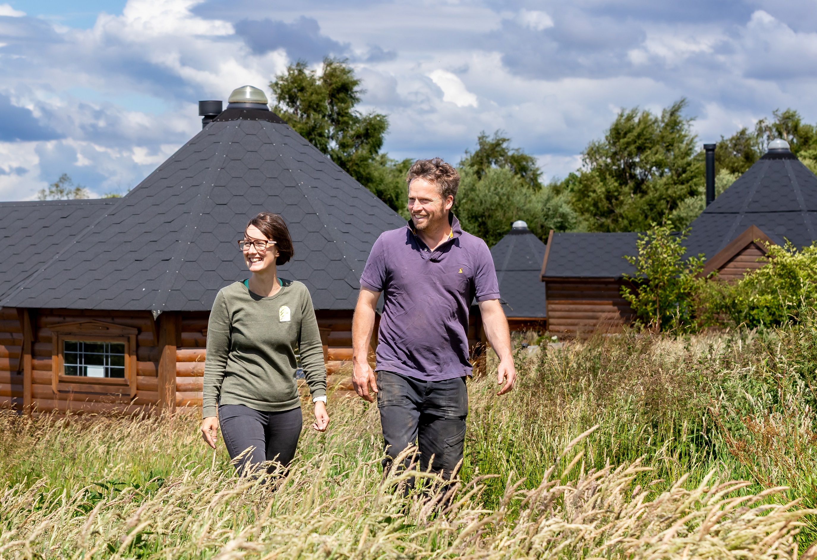 Joanne and Sean Nicholson outside glamping pods that have been introduced at her family’s farm