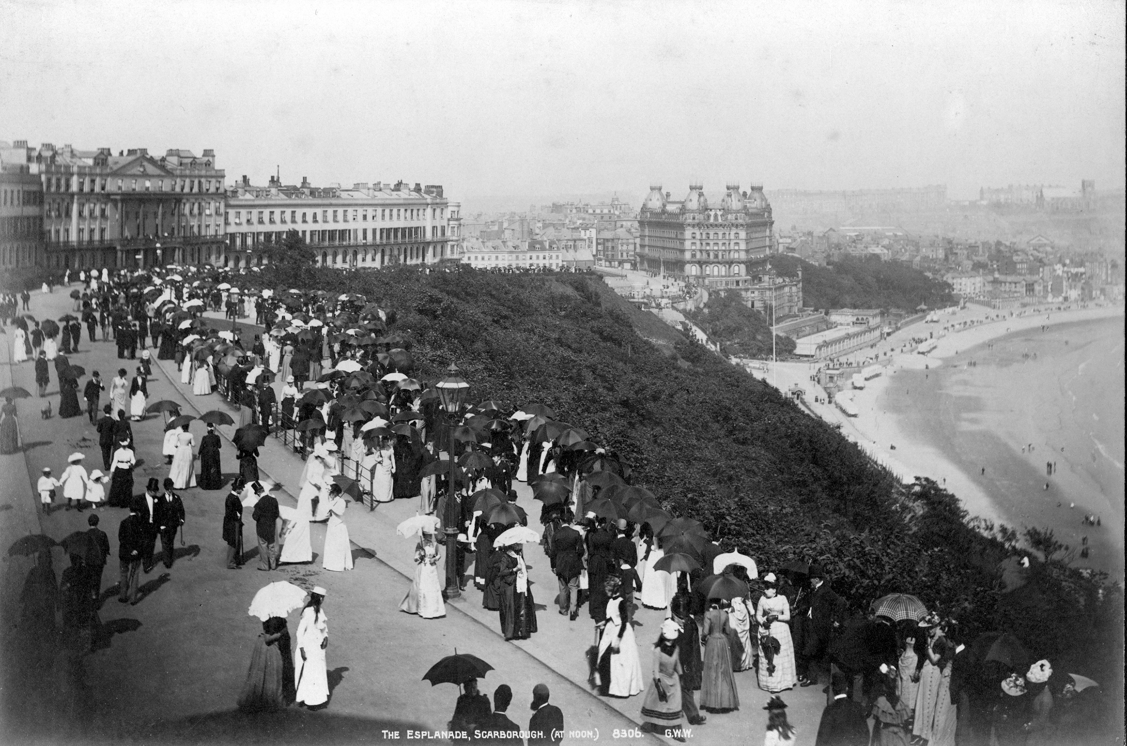 Victorian visitors in their Sunday best walk along the Esplanade in Scarborough
