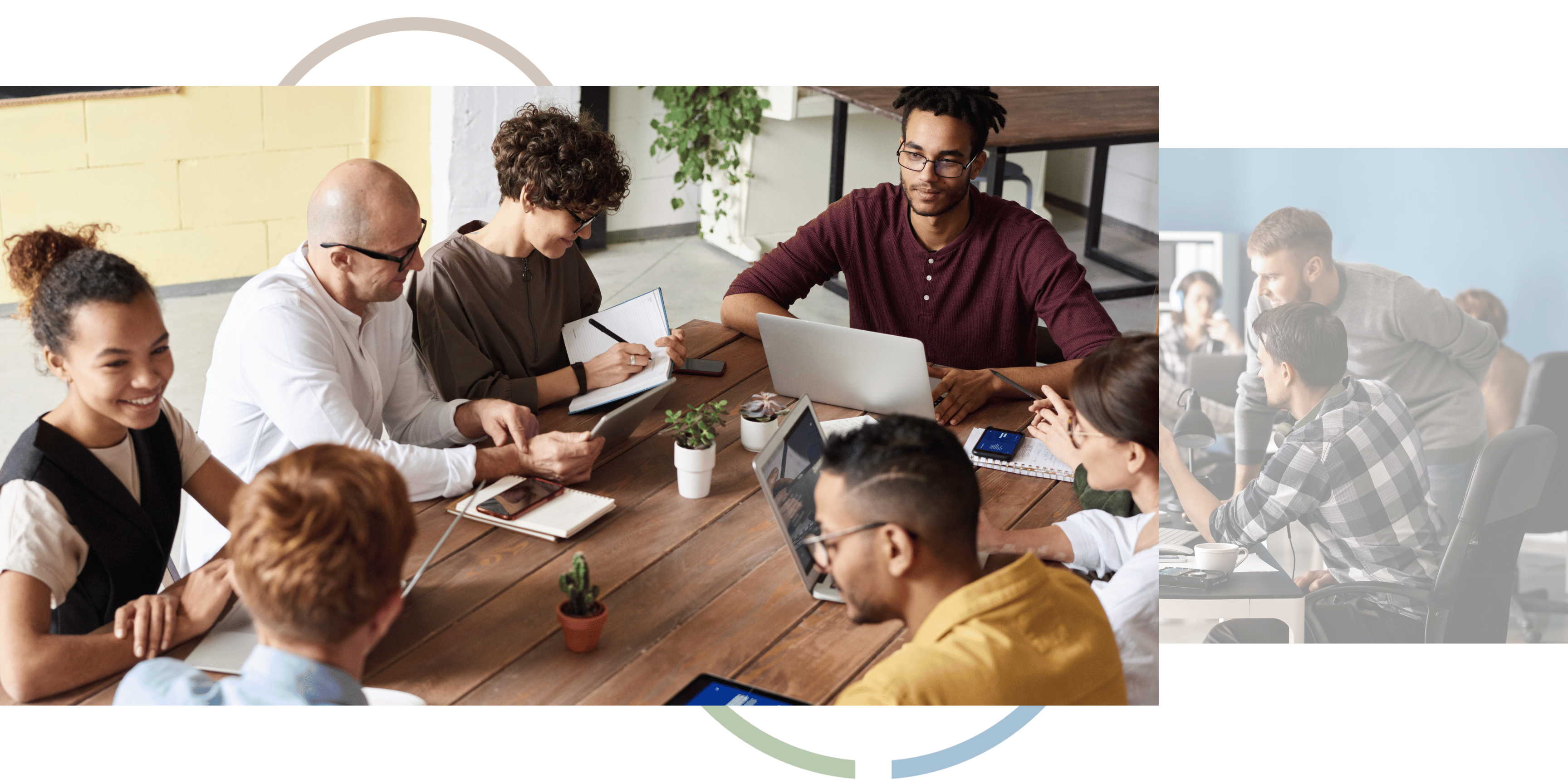Group of people sitting around a wooden table with laptops, tablets, mobiles and notepads