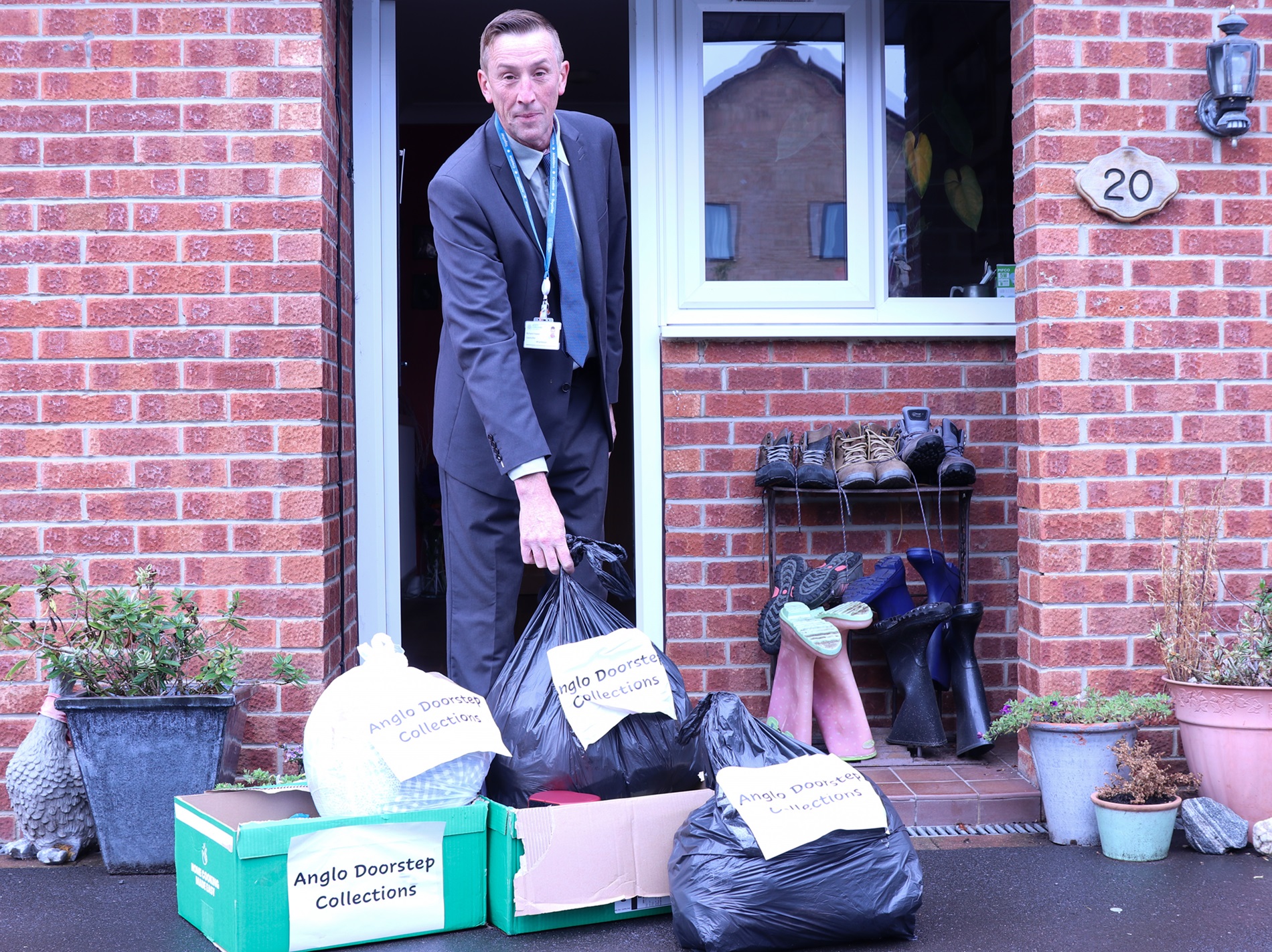 Cllr Richard Foster with boxes of unwanted items