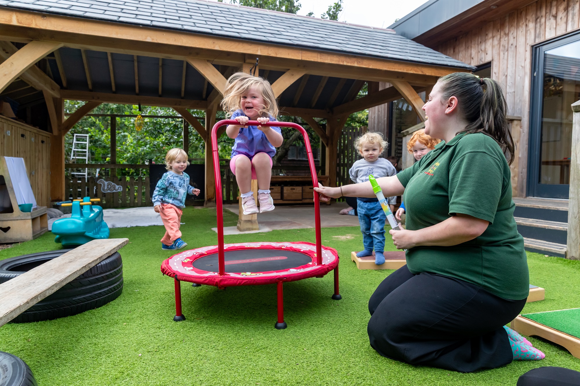 A child enjoys her trampoline.