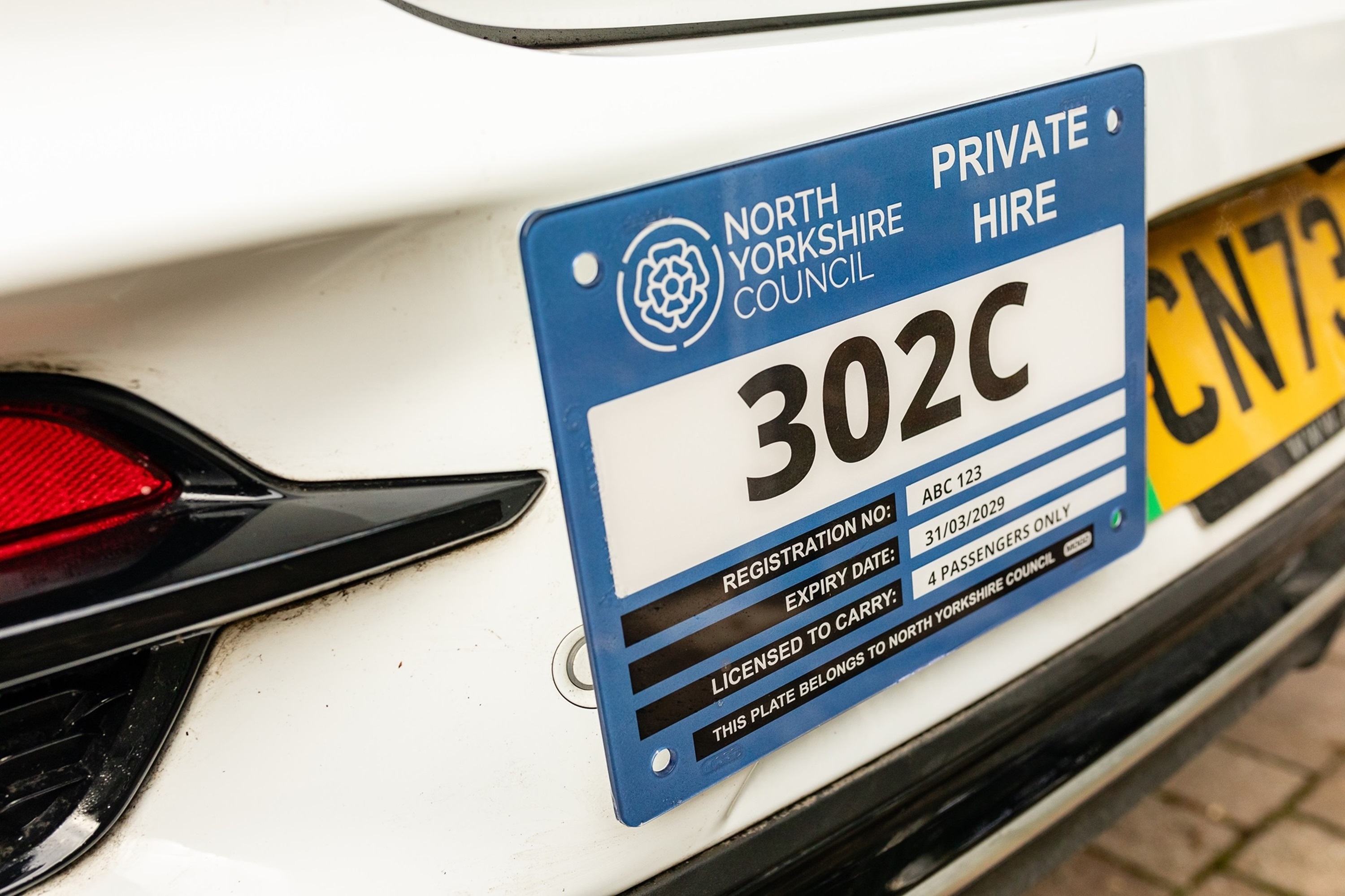 Image of a private hire plate.
