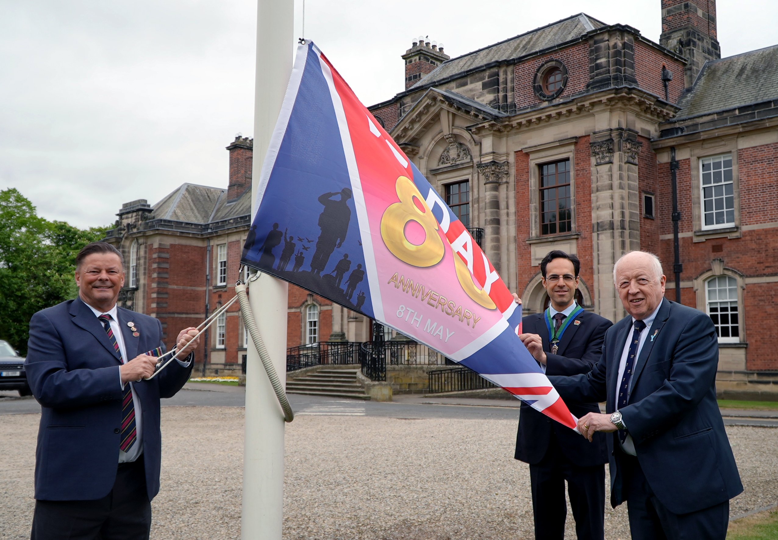 Left to right, Armed Forces champion, Cllr Kevin Foster, vice-chair, Cllr George Jabbour, and council, Cllr Carl Les, at the flag-raising event at County Hall in Northallerton to mark the 80th anniversary of VE Day.