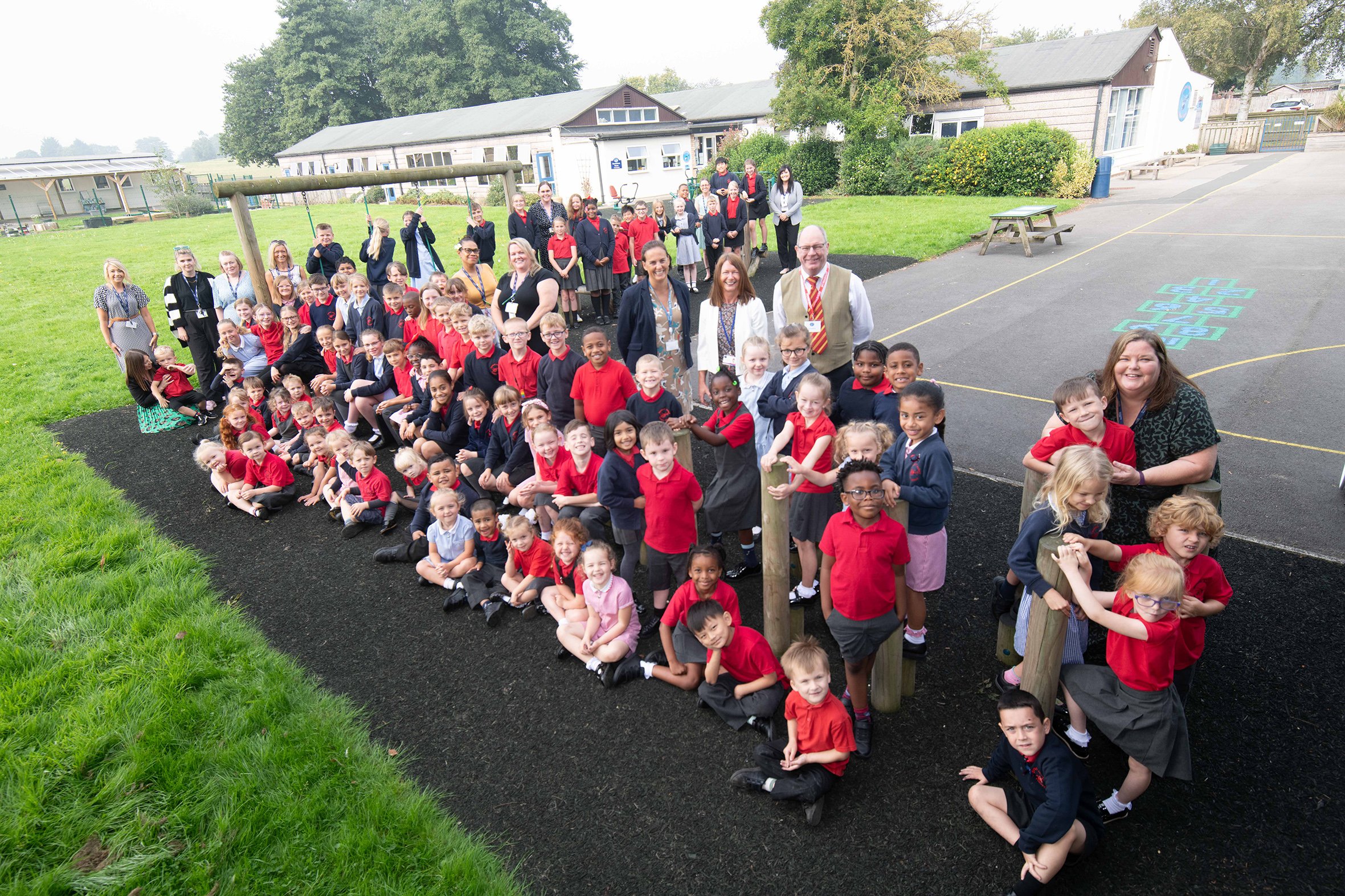 Council’s assistant director for education and skills, Amanda Newbold, with headteacher Mrs Julie Lyon, celebrating the top Ofsted rating with delighted pupils and staff at Dishforth Airfield Primary School.