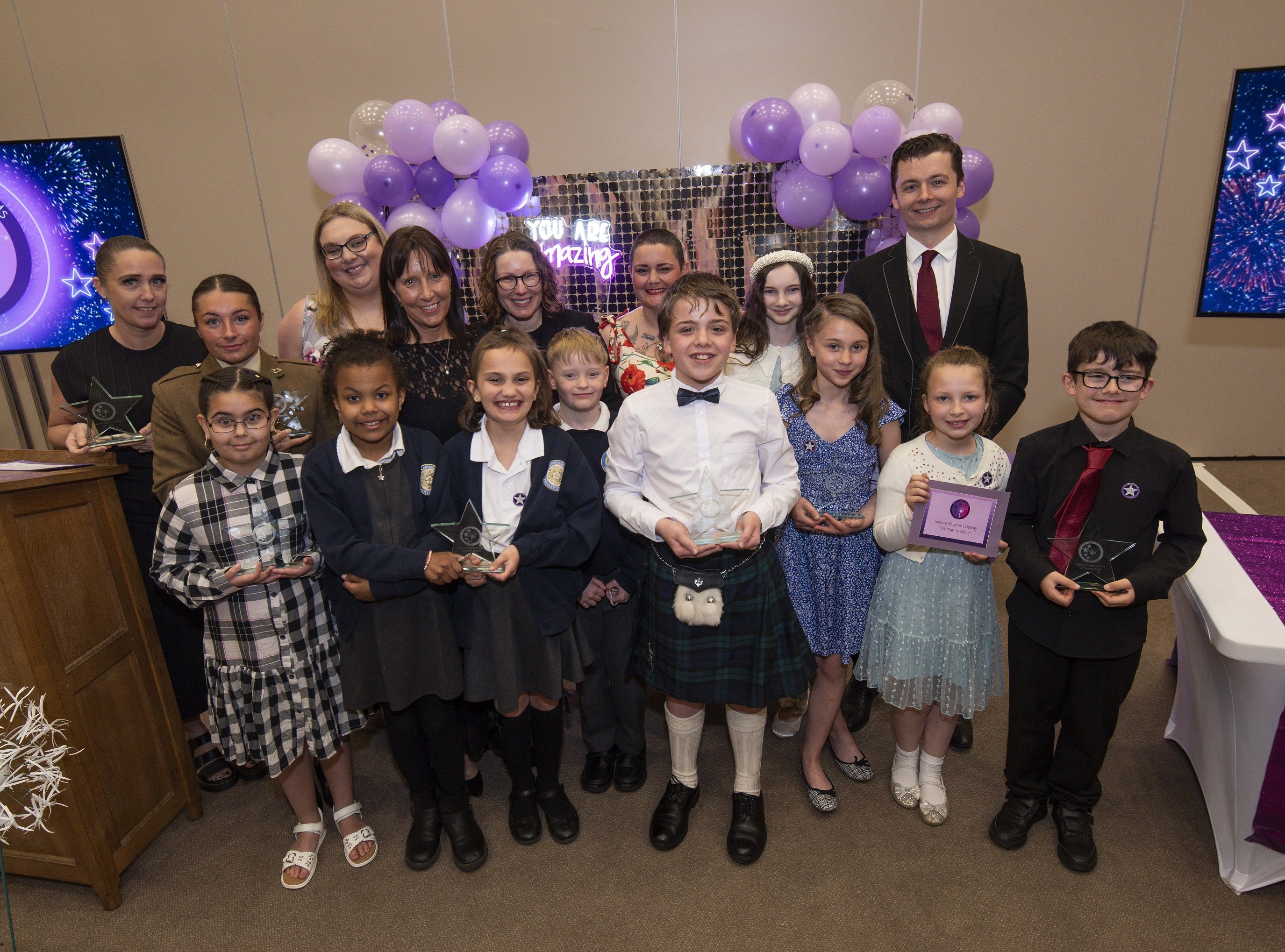 A group of children with awards