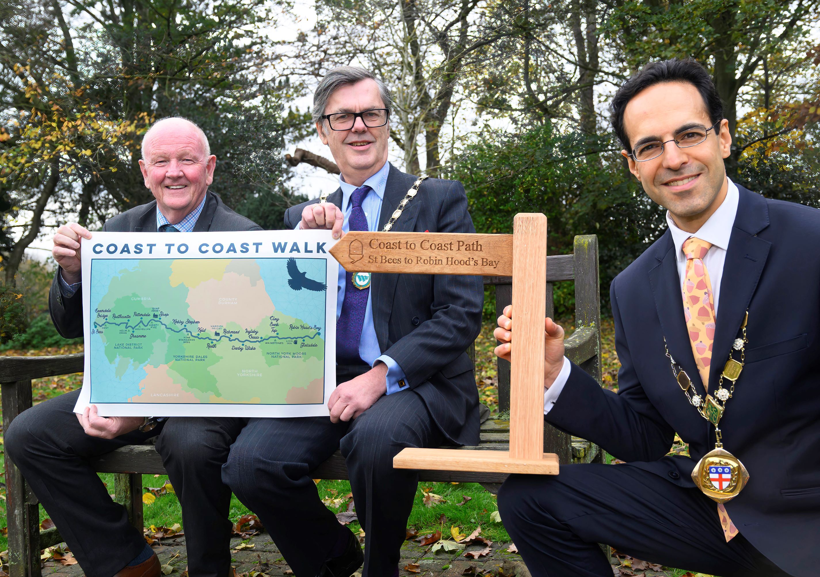 The chair of North Yorkshire Council, Cllr George Jabbour, is joined by his counterparts from Cumberland Council and Westmorland and Furness Council, Cllr Andy Semple and Cllr Doug Rathbone, at County Hall in Northallerton to champion the Coast to Coast Walk which crosses the three areas.