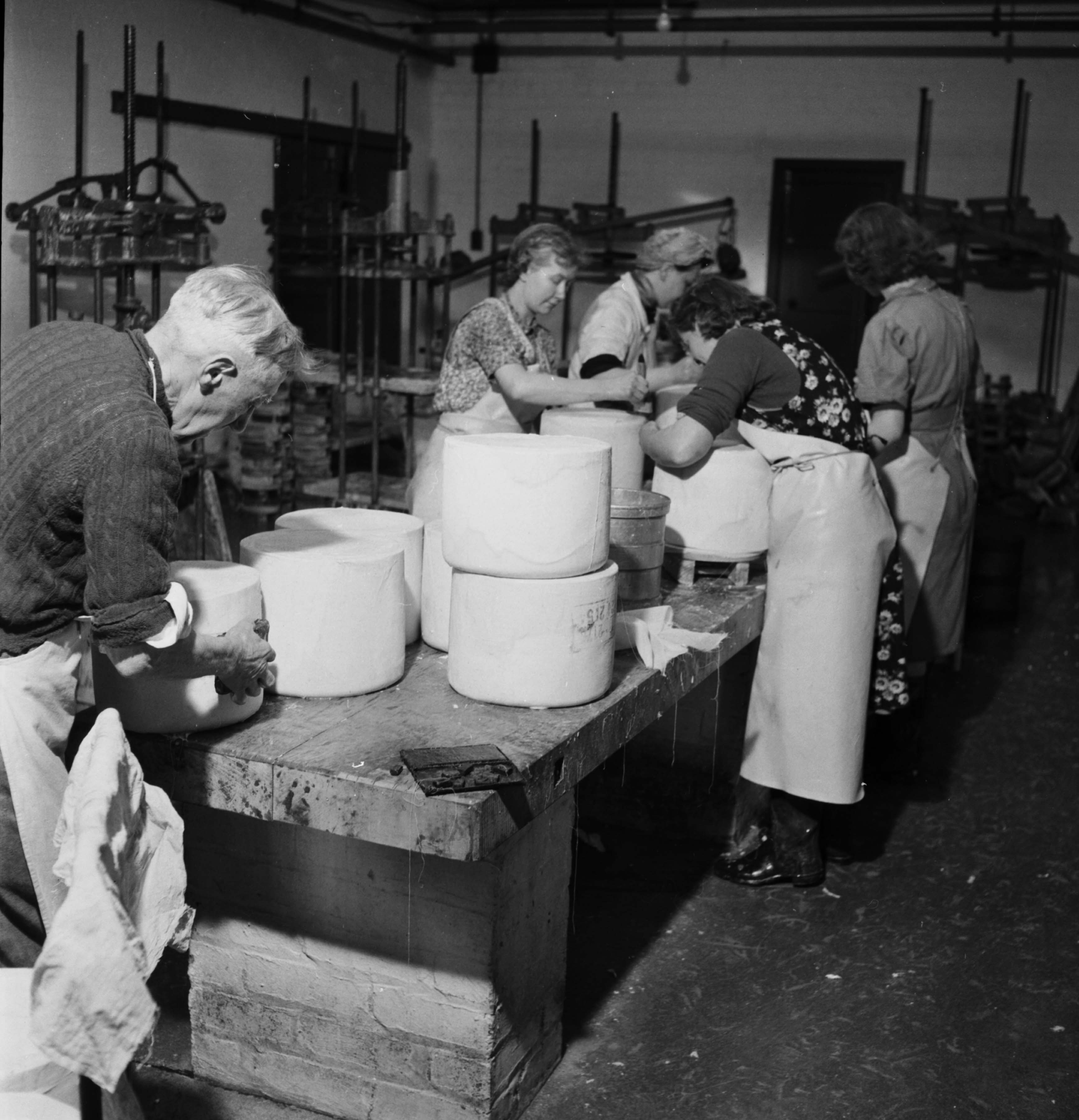 Cheesemaking at Hawes creamery, Wensleydale (mid 20th century). From the Bertram Unné photographic collection.