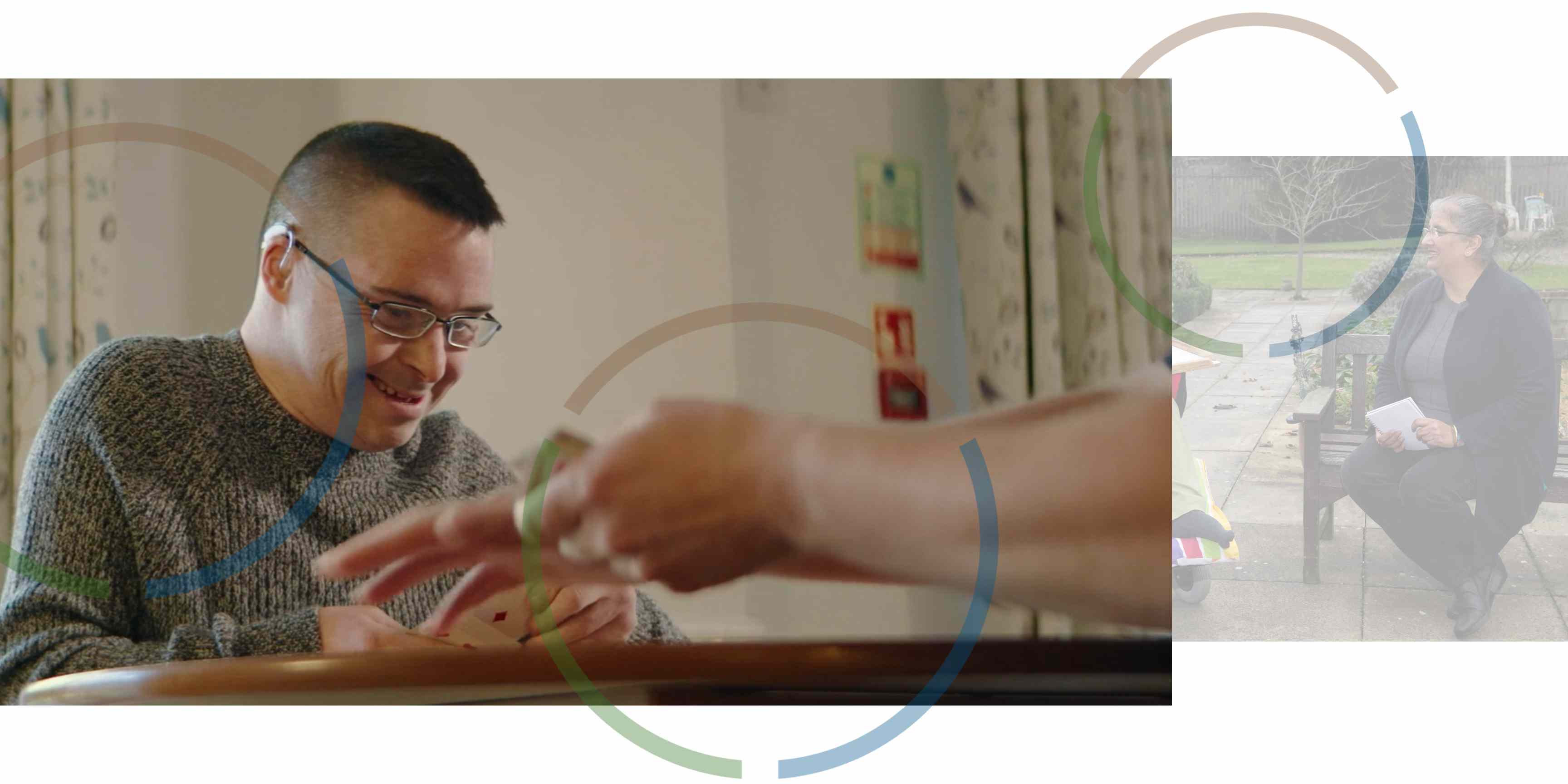 Person sitting at a wooden table playing cards