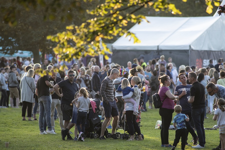 People gathering at outdoor event