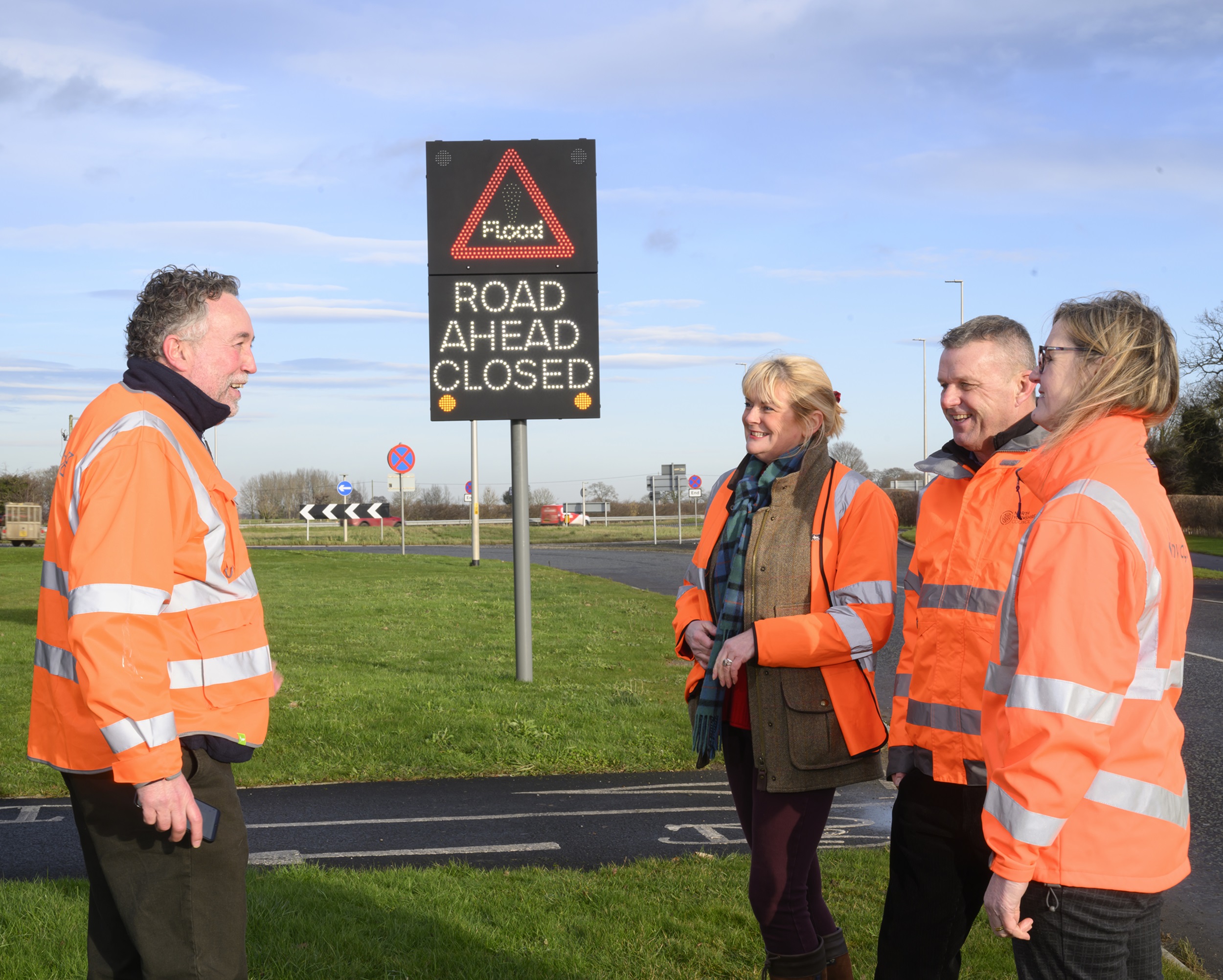 A group of people stood near a sign on the Bedale bypass