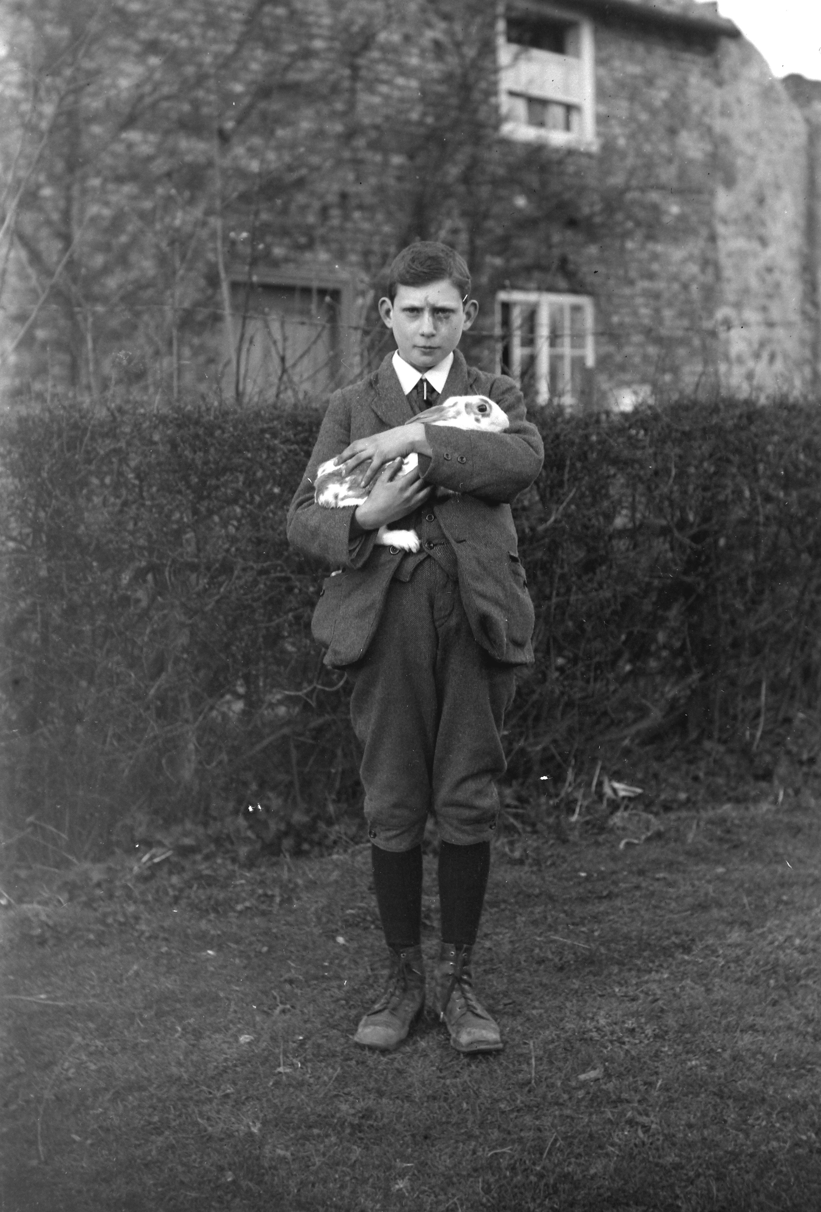 Norman Kemp and his pet rabbit (1920). From a collection of photographs of the Dunsforth area by local amateur photographer Louisa Kruckenberg.