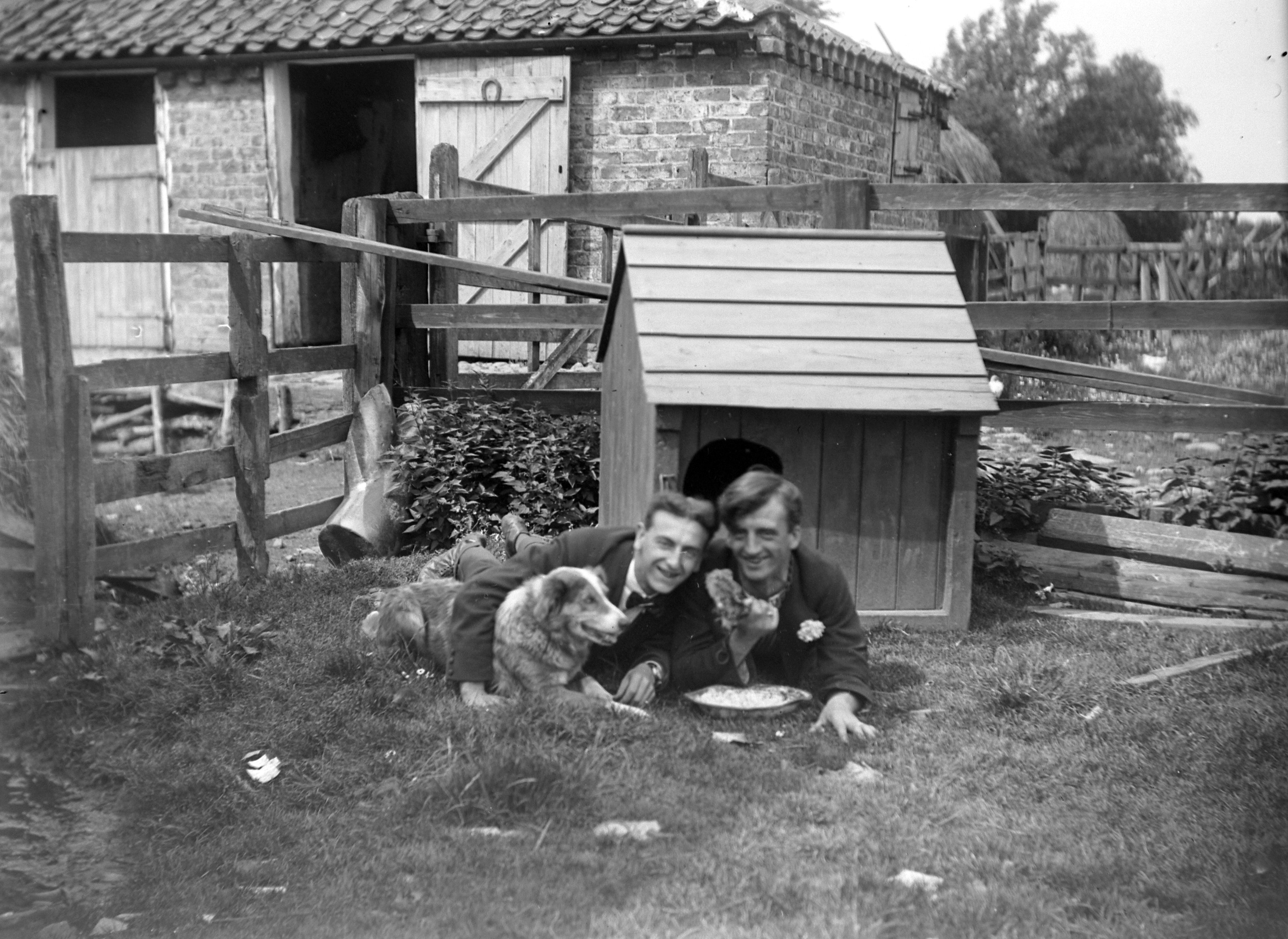 Two men and their dog (1920). From a collection of photographs of the Dunsforth area by local amateur photographer Louisa Kruckenberg.