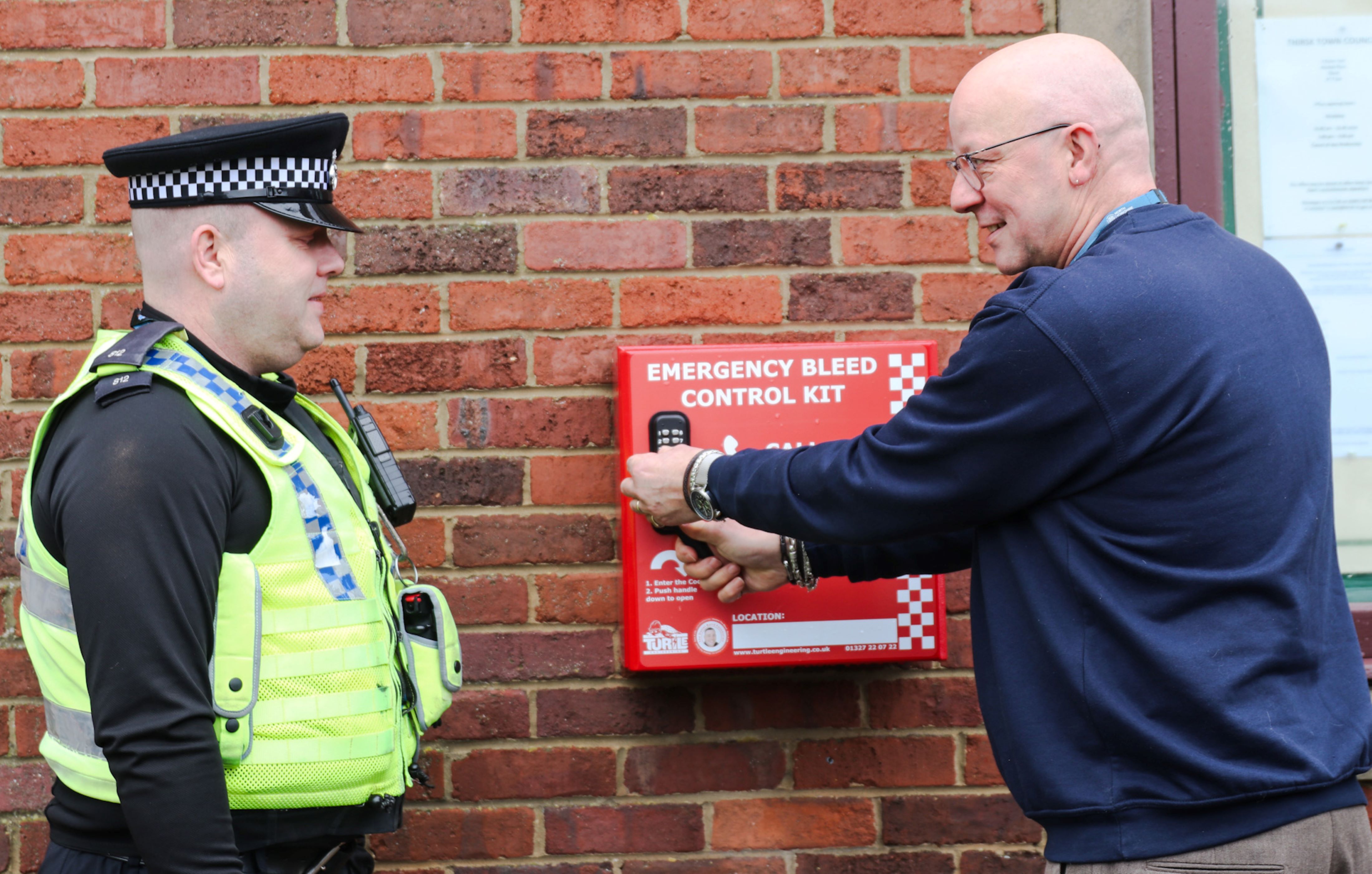 PC Paul Mushens, of North Yorkshire Police, is shown the Daniel Baird Foundation #controlthebleed kit by North Yorkshire Council’s community safety officer, Philip Wright, in the Market Place, Thirsk