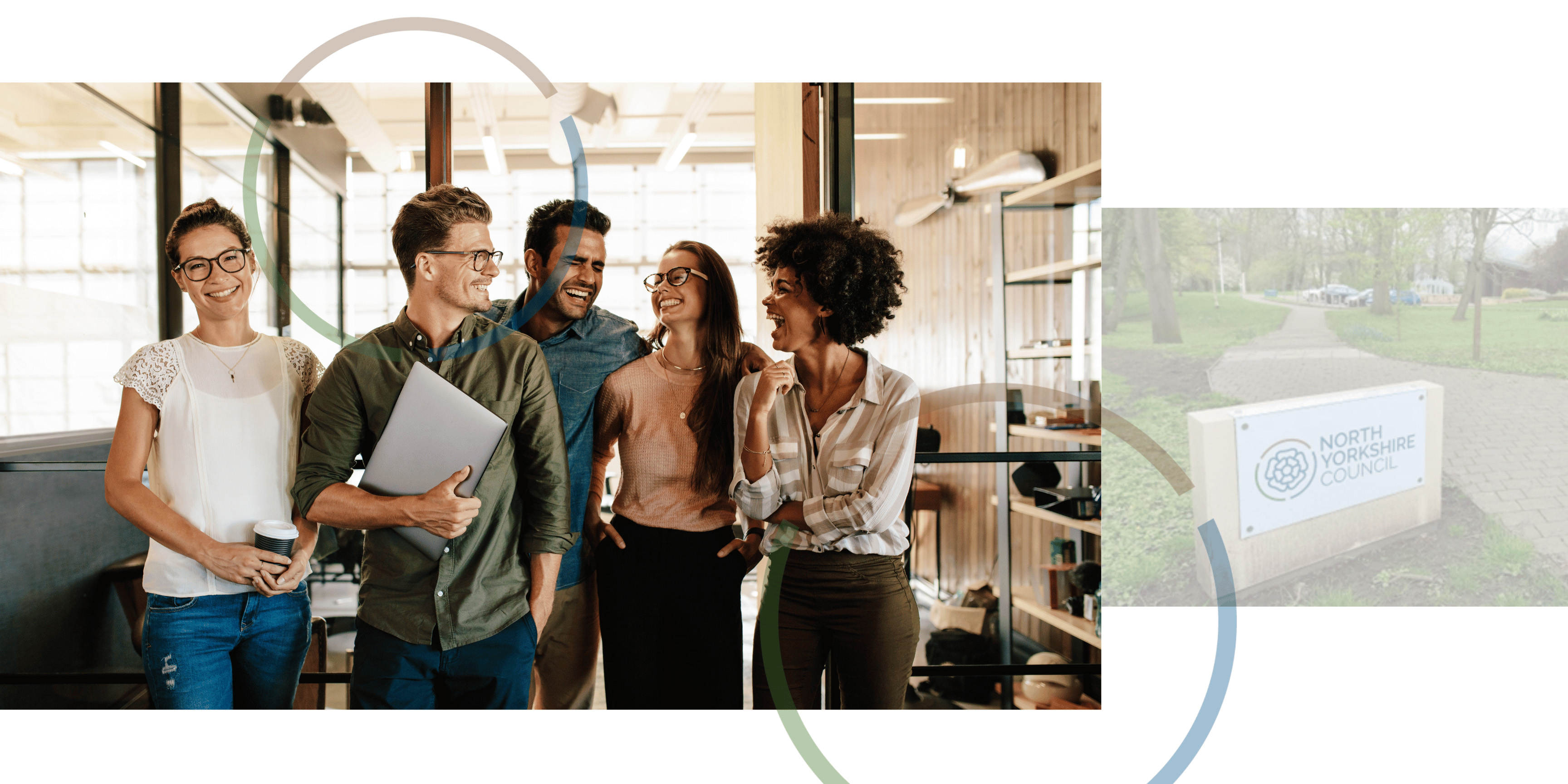 Group of people walking and talking down corridor.