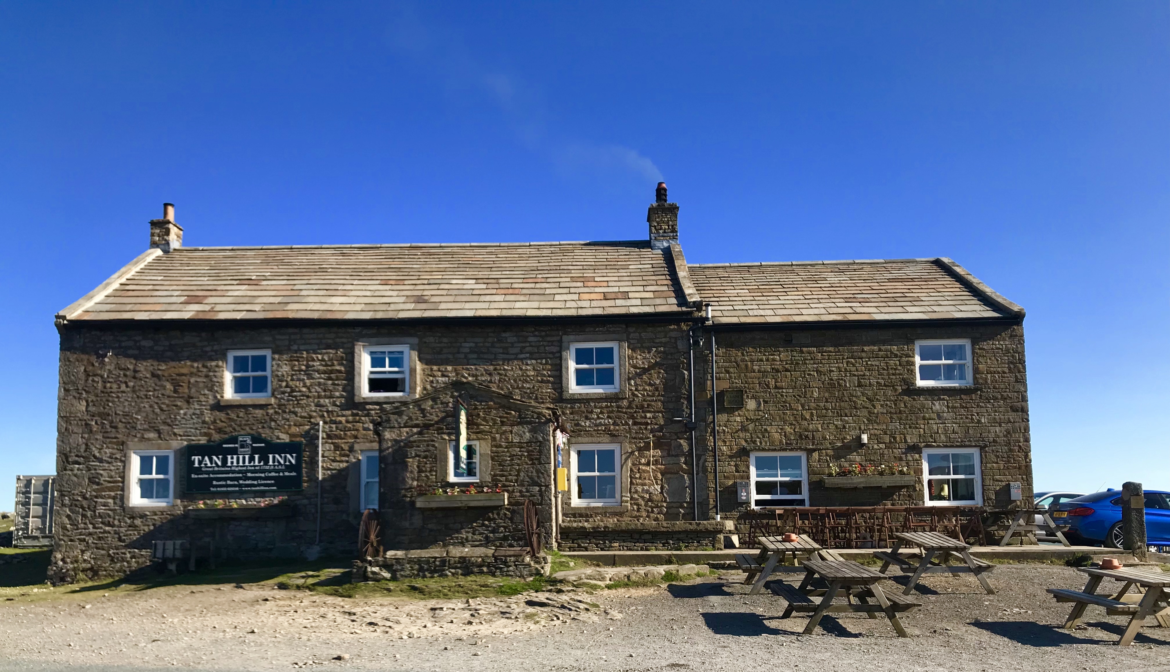 External photo of Tan Hill Inn on a sunny day