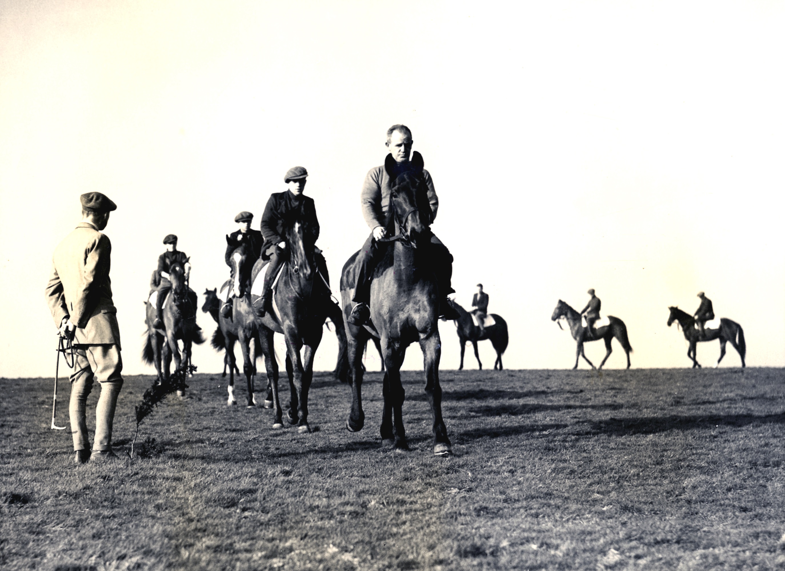 Black and white photo of racehorses at Middleham being exercised.