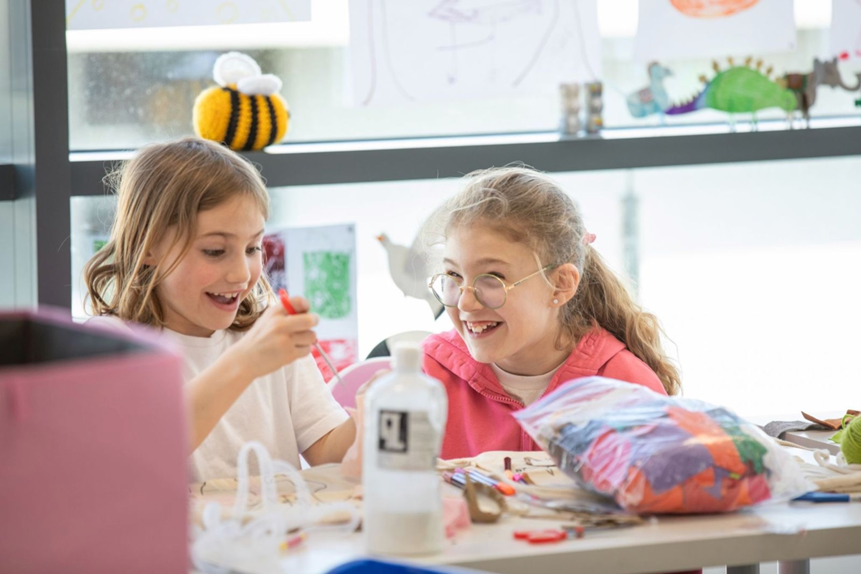 Two young girls enjoying FEAST activities