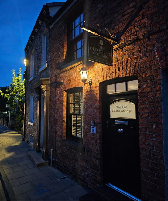 Outside The Old Police Cottage at night time
